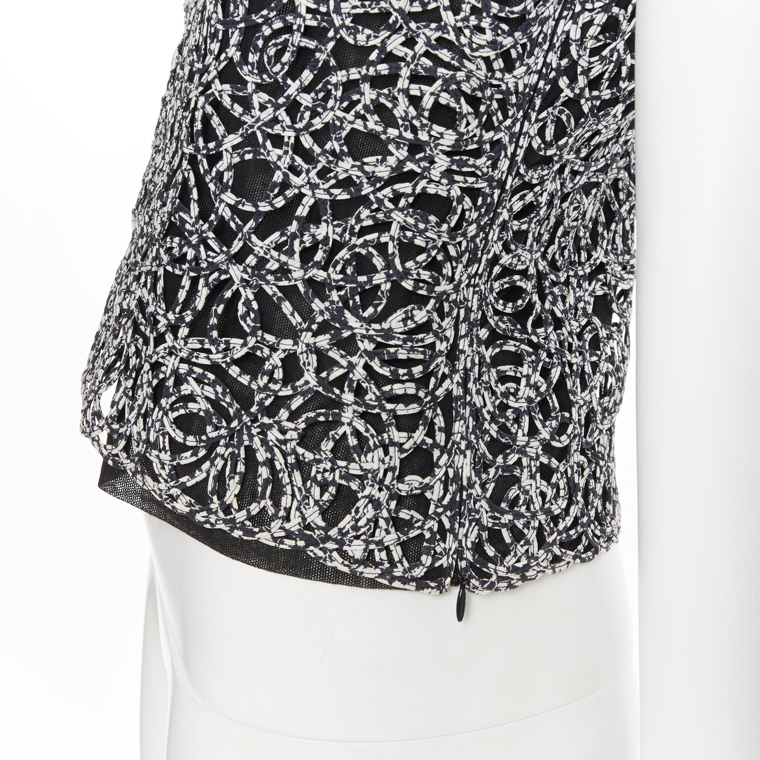 CHANEL 09P chaleco sin mangas con estampado abstracto blanco y negro FR36 4