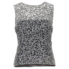 CHANEL 09P chaleco sin mangas con estampado abstracto blanco y negro FR36