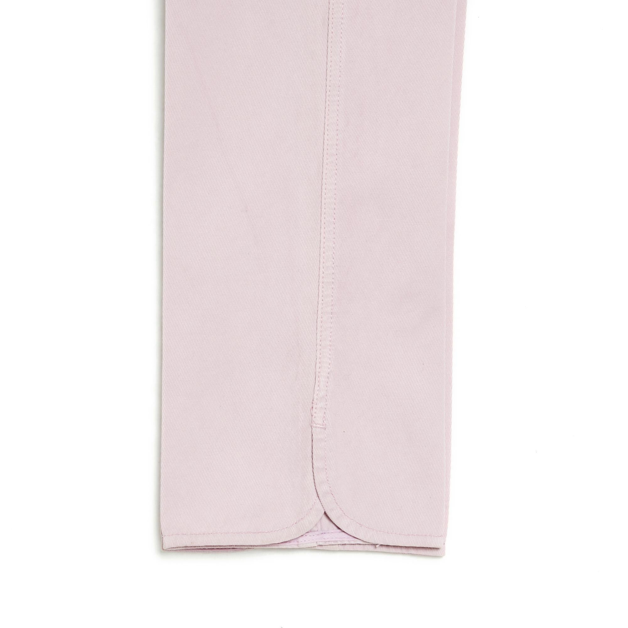 Chanel Jeans from the Spring Summer 2009 collection, low waist, straight leg, in pale pink, slightly mauve denim, belt loops, jean pockets, rounded slit on the outside of both legs. No more size label but the measurements indicate a 38FR or UK10 and