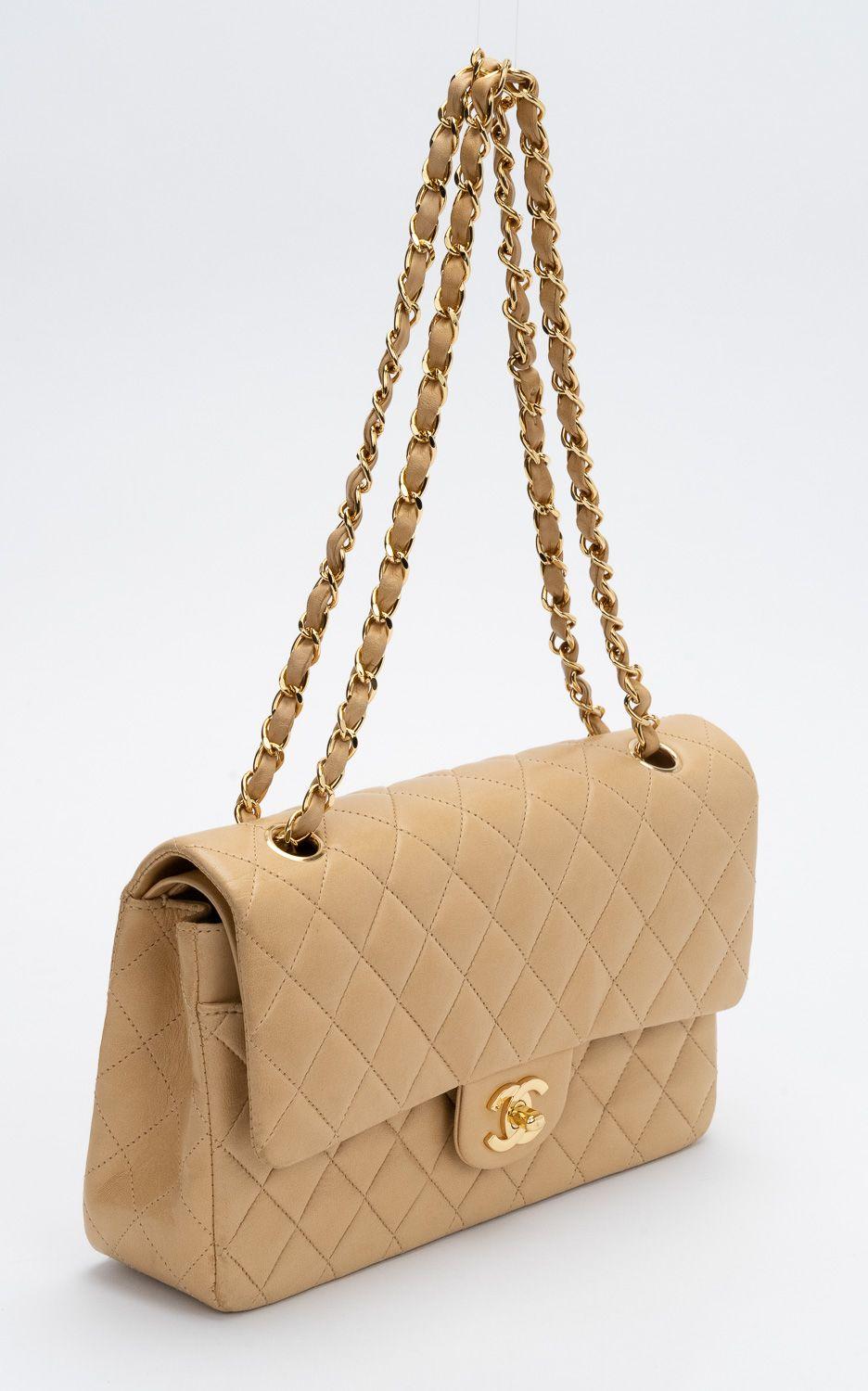 Chanel quilted double flap classic medium bag in beige leather and gold tone hardware. Shoulder drop, 9