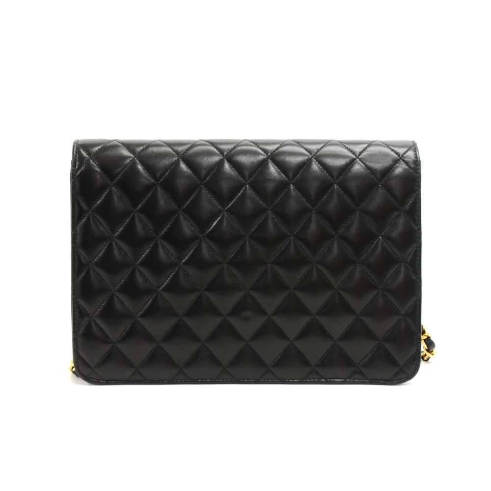 Chanel Black leather quilted shoulder bag. It has a half flap with famous CC twist lock on the front. Inside has Chanel red leather lining with 1 zipper pocket. It can be used as a shoulder bag or clutch. This is a very smart and classic design