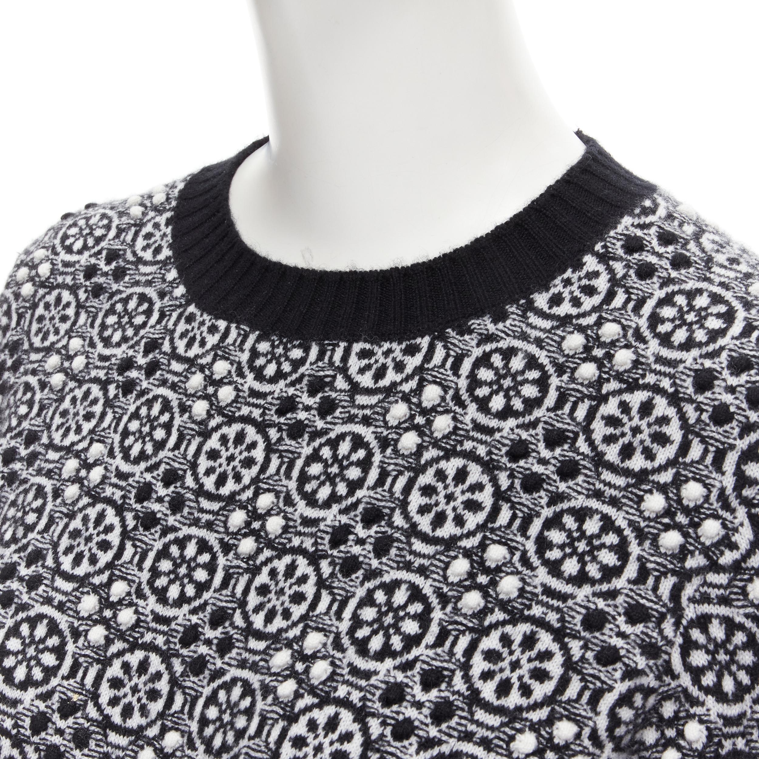CHANEL 100% cashmere geometric pattern 3D Jacquard knit pullover sweater FR36 XS 
Reference: MELK/A00037 
Brand: Chanel 
Material: Cashmere 
Color: Black 
Pattern: Geometric 
Extra Detail: 3D textured Jacquard knit. Silver-tone CC charm at hem.