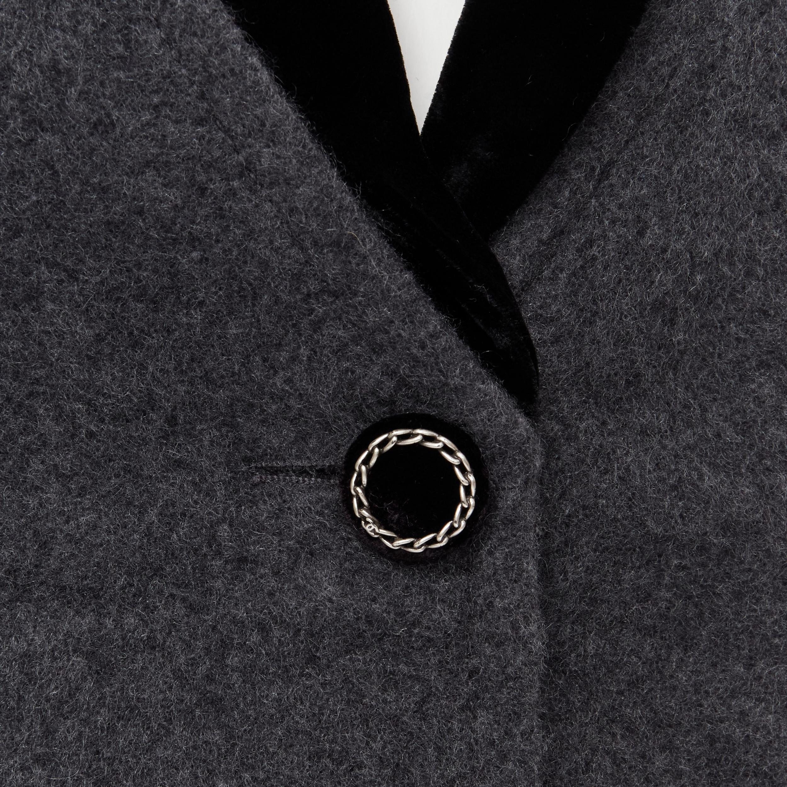CHANEL 100% cashmere grey black velvet trimmed CC chain button rounded blazer FR36 S 
Reference: MELK/A00017 
Brand: Chanel 
Material: Cashmere 
Color: Grey 
Pattern: Solid 
Closure: Button 
Extra Detail: 100% cashmere. Black velvet trimming. Padded