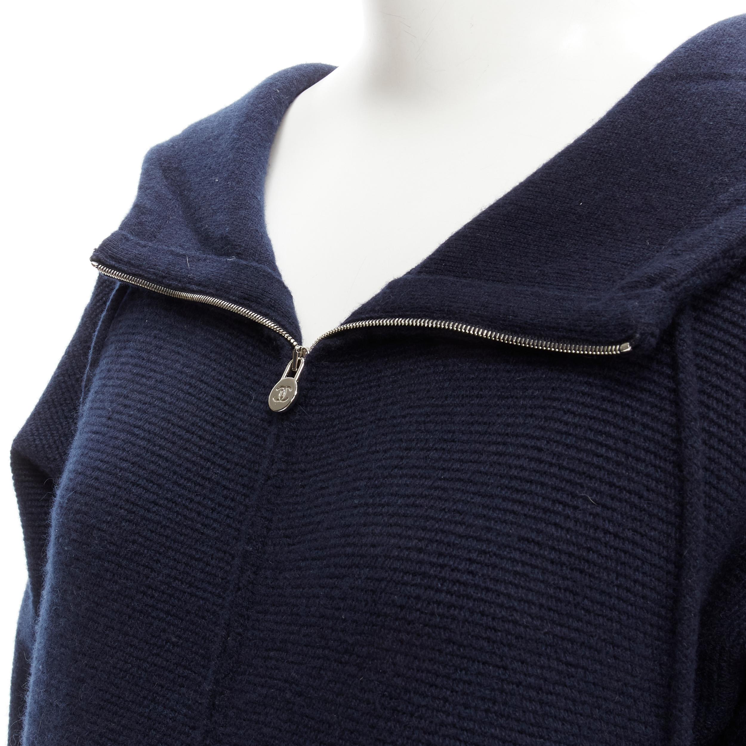 CHANEL 100% cashmere navy silver CC zip up hooded sweater FR34 XS 
Reference: JACG/A00022 
Brand: Chanel 
Material: Cashmere 
Color: Navy 
Pattern: Solid 
Closure: Zip 
Extra Detail: Drawstring hood. CC button front pockets. Drawstring at hem.