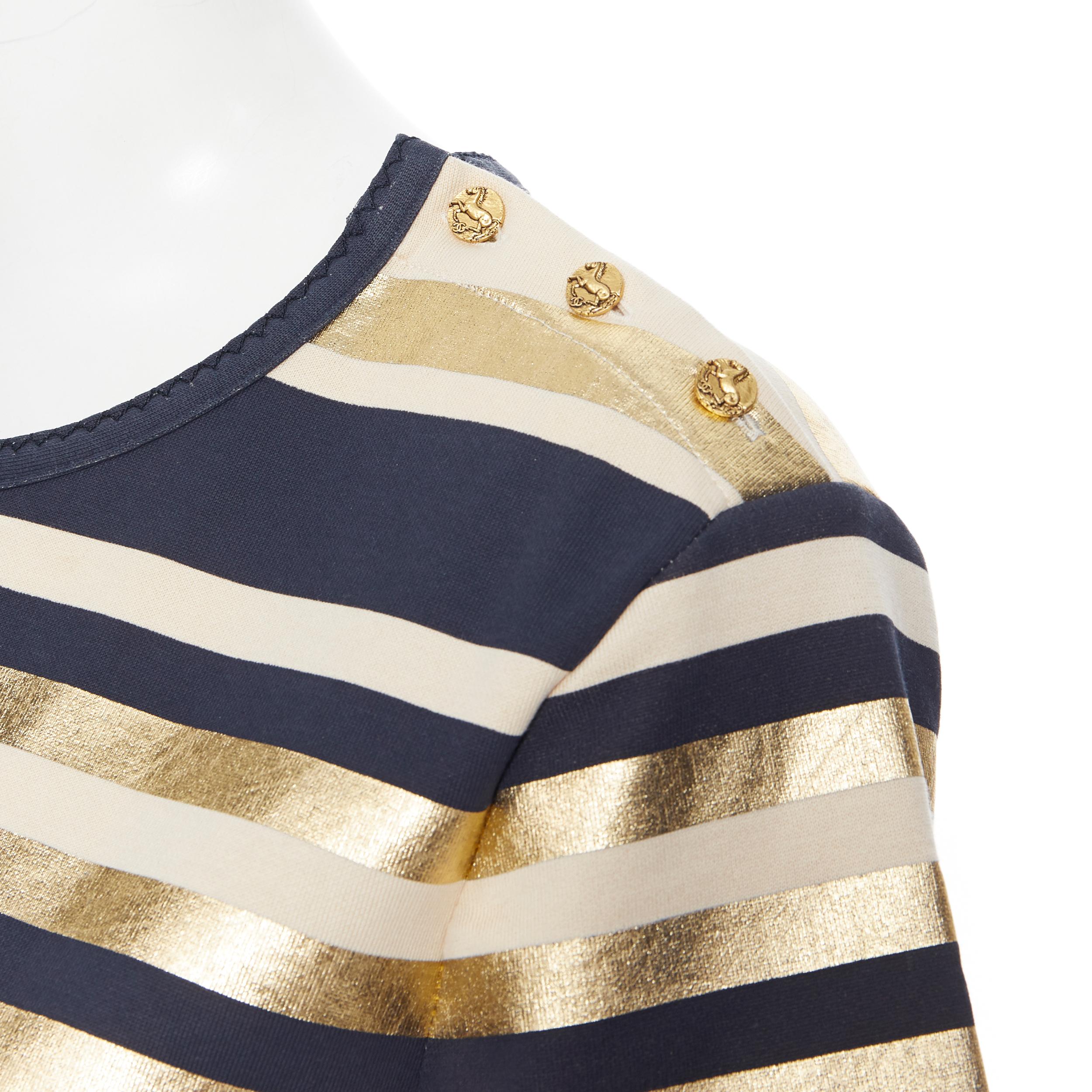 CHANEL 100% cotton metallic gold navy striped gold button short sleeve top FR40
Brand: Chanel
Designer: Karl Lagerfeld
Model Name / Style: T-shirt
Material: Cotton
Color: Gold, navy
Pattern: Striped
Closure: Button
Extra Detail: Gold tone hammered