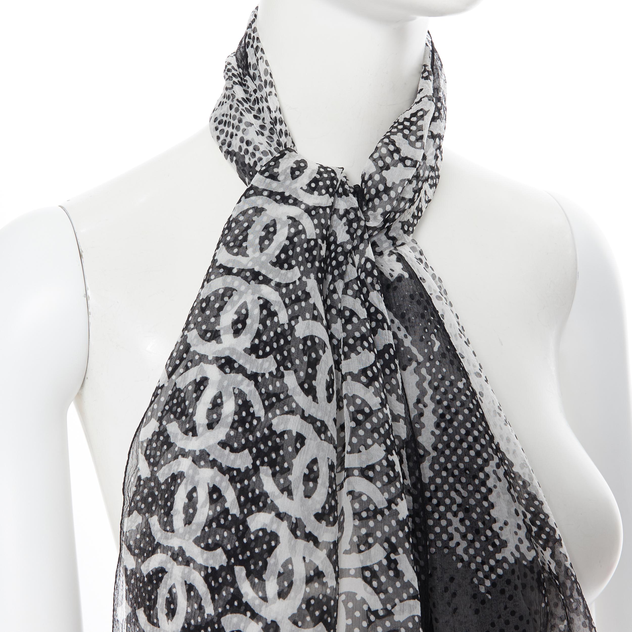 CHANEL 100% silk black white logo monogram scarf
Brand: Chanel
Model Name / Style: Silk scarf
Material: Silk
Color: Black
Pattern: Abstract
Extra Detail: 100% silk. Black white CC monogram print.
Made in: Italy

CONDITION: 
Condition: Excellent,