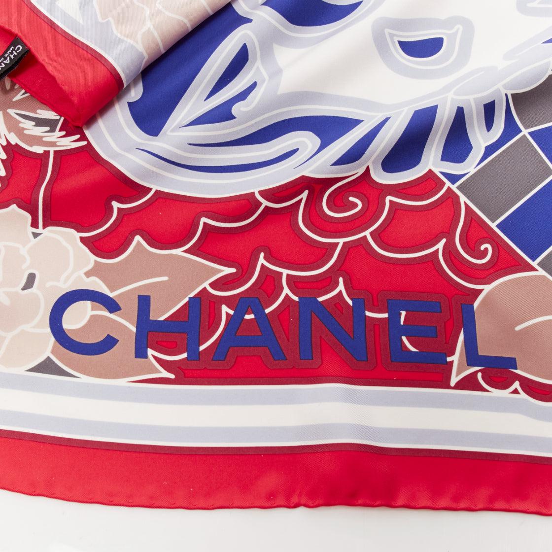 CHANEL 100% silk red blue lion statue palm trees big square scarf
Reference: AAWC/A00938
Brand: Chanel
Material: Silk
Color: Red, Blue
Pattern: Abstract
Extra Details: Abstract lion statue and palm tress print with CC logo.
Made in: