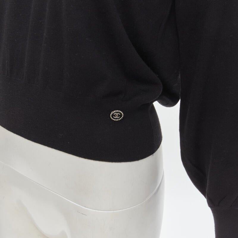 CHANEL 100% wool black white cable knit varsity collar CC charm sweater FR38 M
Reference: KNLM/A00109
Brand: Chanel
Designer: Karl Lagerfeld
Model: P62591K48078
Material: Wool
Color: Black, Cream
Pattern: Solid
Extra Details: Weave detail at collar.