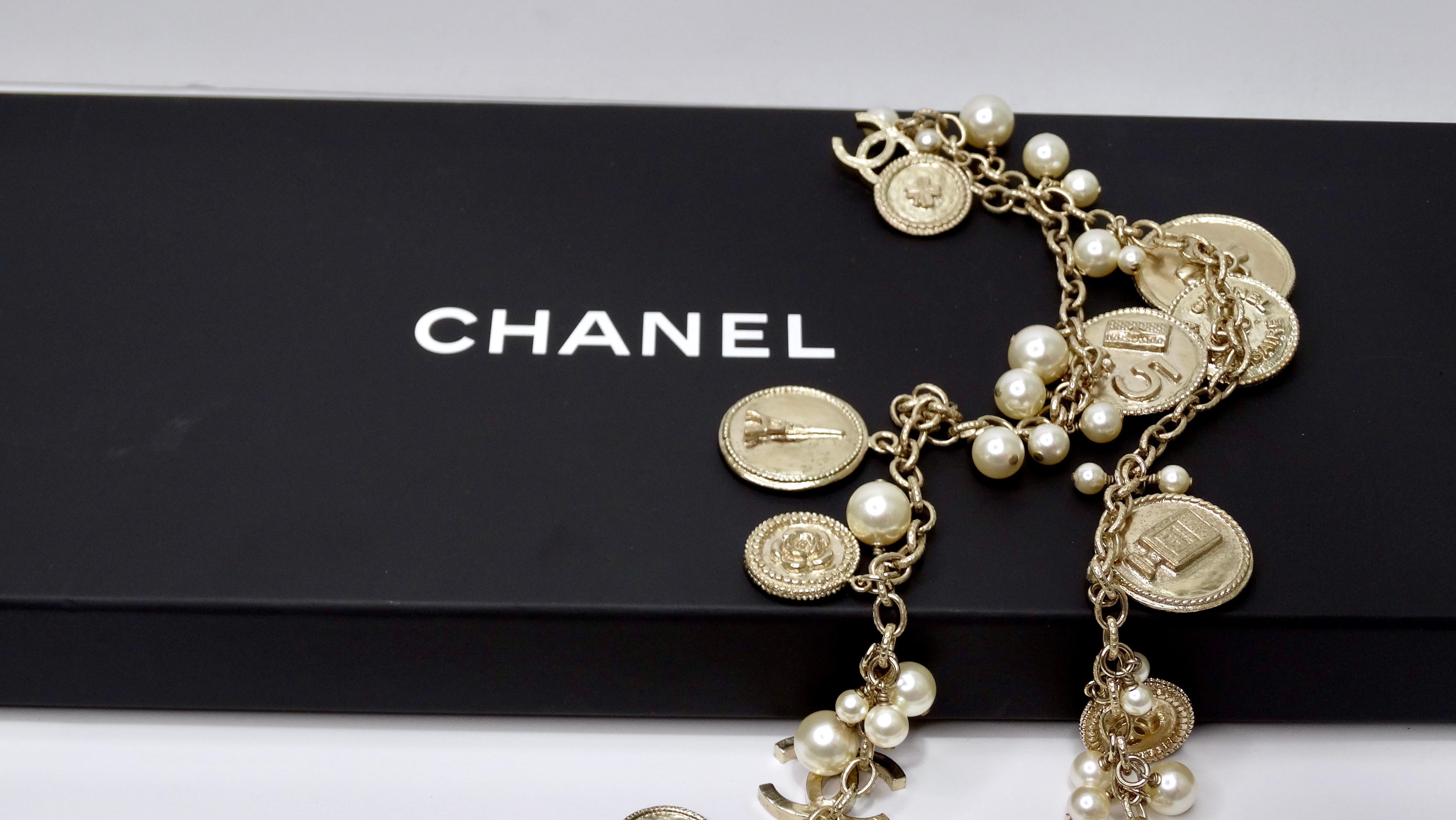 Get your piece of ultra-rare Chanel here! From the Chanel 100th Anniversary collection in the year 2014, this is a gem! A no-brainer!! It is in great condition with no notable flaws. This necklace is featured in a vibrant light gold-tone metal