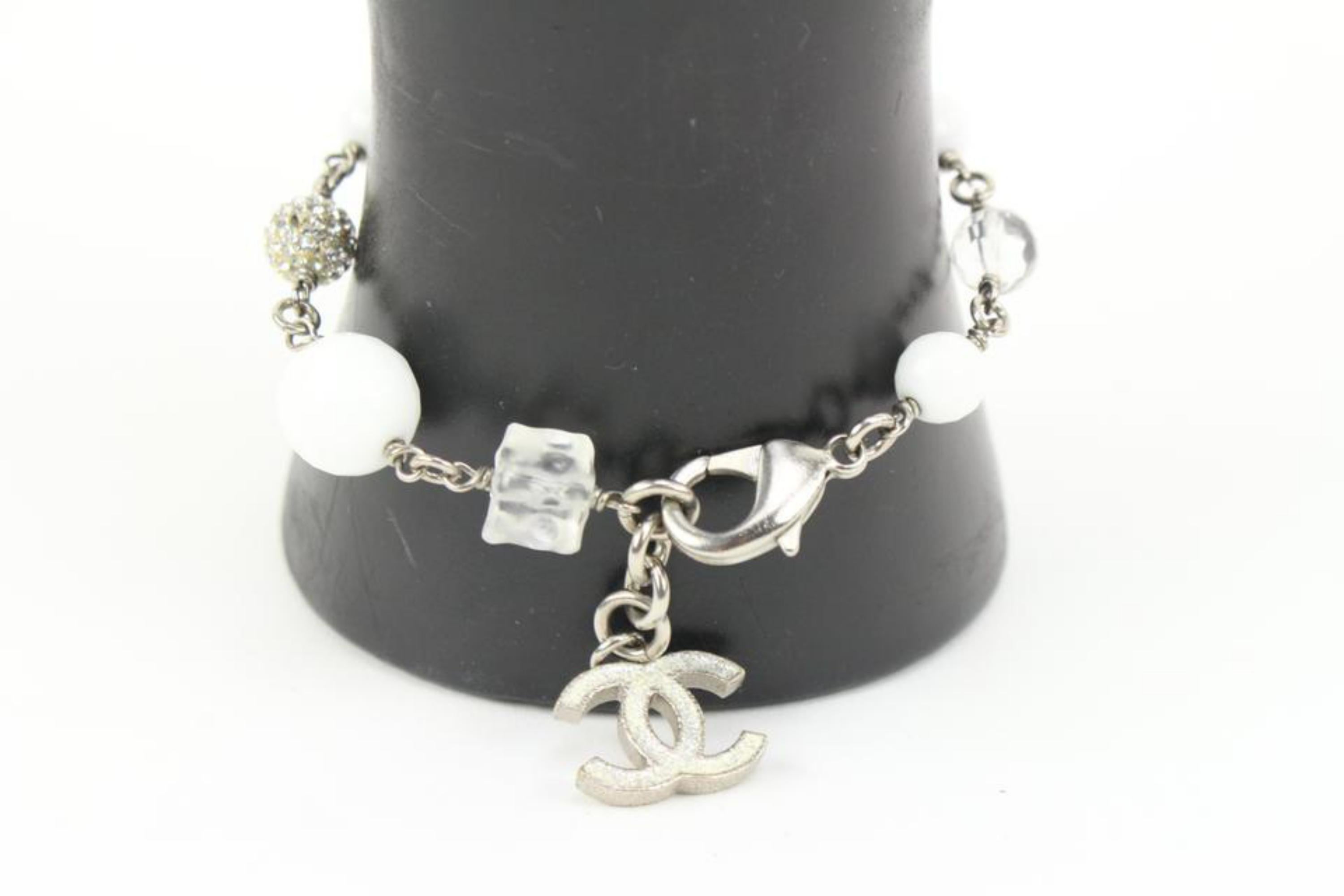 Chanel 10A Crystal x Cube x Pearl Silver Chain Bracelet 14ck311s
Date Code/Serial Number: B10 A
Made In: Italy
Measurements: Length:  8.5