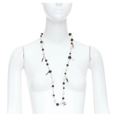CHANEL 10C Runway CC Logo Faux Pearl Sautoir coco figurine charm necklace