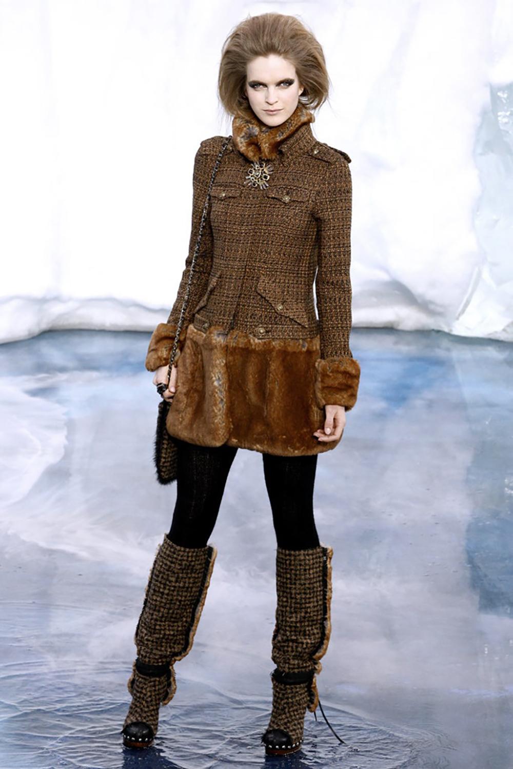 Stunning Chanel black tweed coat with fantasy faux fur details -- from ARCTIC ICE Collection by Karl Lagerfeld.
Boutique price 9,860$
- CC logo jewel buttons, logo zip front closure
- hand-crafted black bead accents throughout the fur parts
- CC