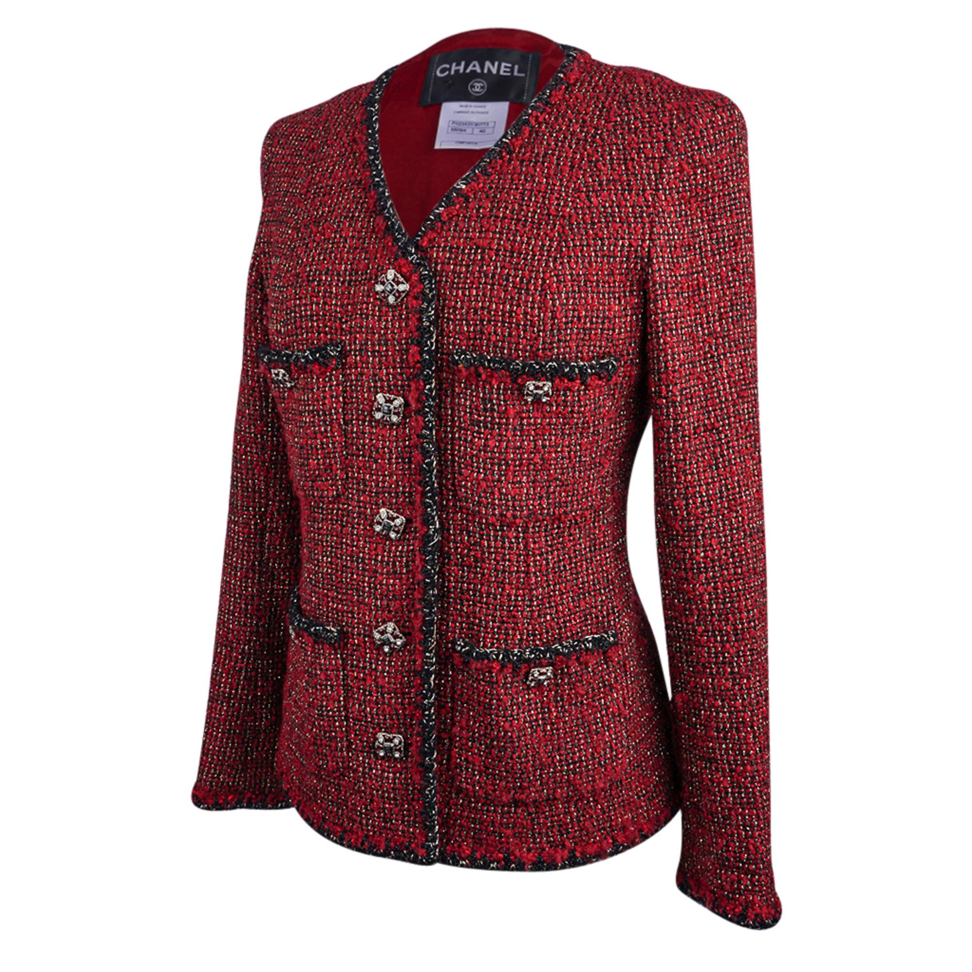 Guaranteed authentic Chanel 11A single breast Red and Black tweed jacket.
Beautiful tweed with Burgundy Red and Black with Gold metallic thread running through it.
V neck with 4 patch pockets.
5 Gripoix jeweled CC logo buttons in front and 1 on each