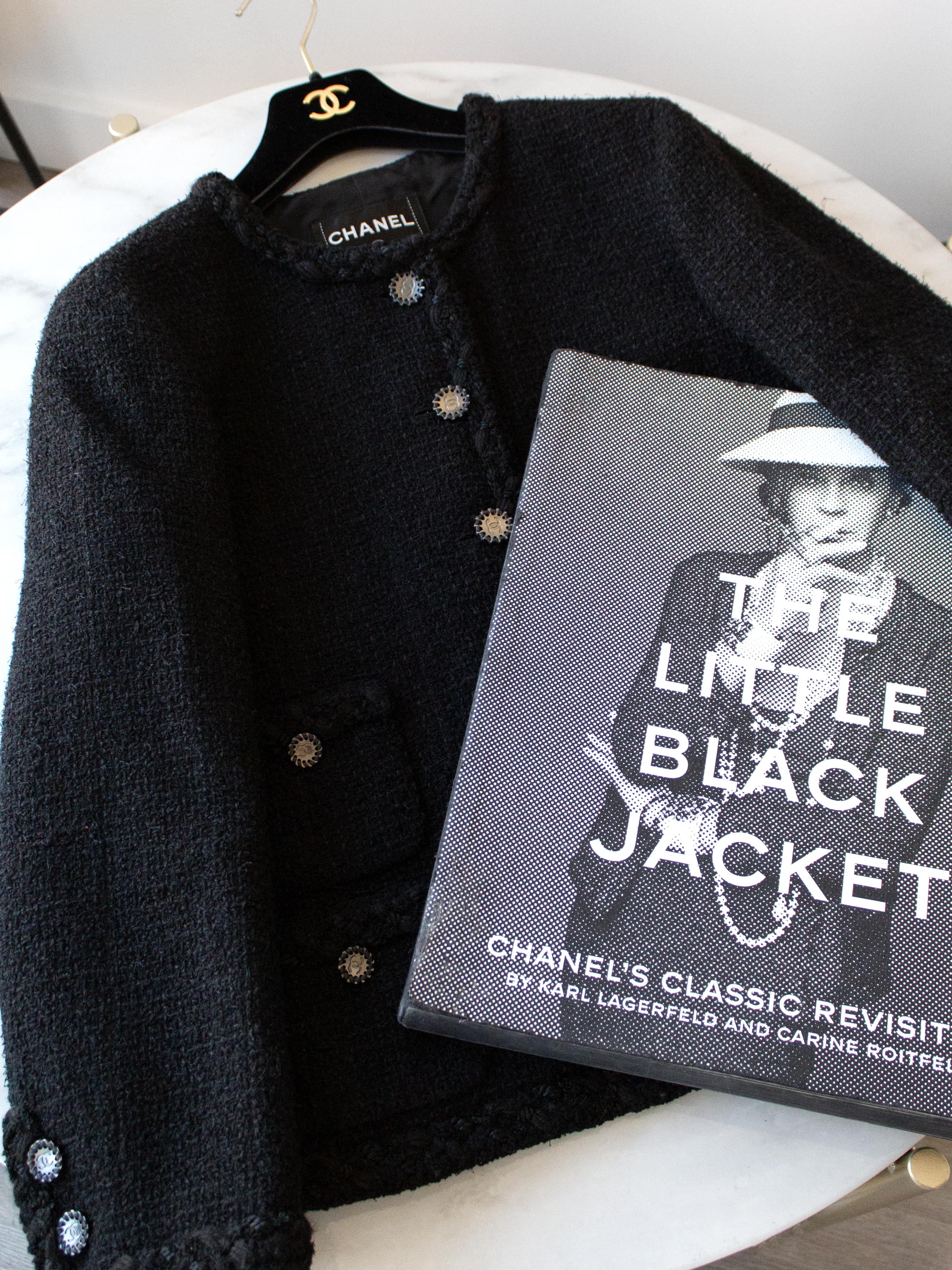 The most famous and iconic Little Black Jacket from Chanel Cruise 2011 collection. Rare to find, collectible heritage piece. The central feature of 'The Little Black Jacket' book and worldwide exhibition by Carine Roitfeld & Karl Lagerfeld. It was