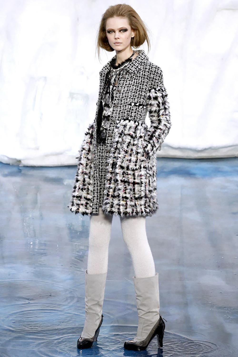 Super rare, collectors Chanel fluffly fantasy tweed coat from ARCTIC ICE Collection by Mr Karl Lagerfeld. Retail price was ca. 12,000$
Size mark 40 fr. Condition is pristine. 
- CC logo jewel Gripoix buttons
- faux-fur like fatasy tweed bottom part: