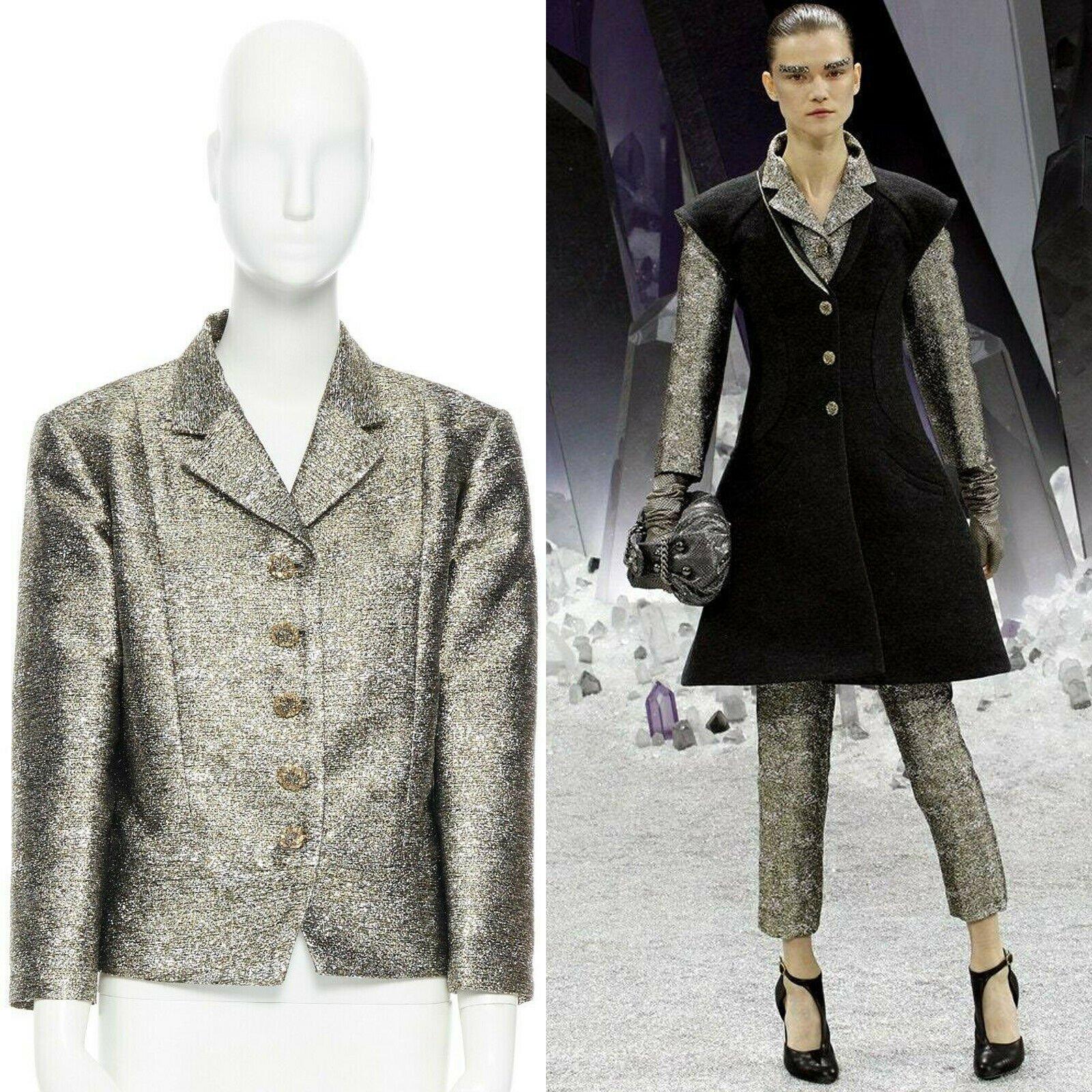 CHANEL 12A metallic silver gold quartz 3/4 sleeves cropped boxy jacket FR50
Brand: Chanel
Designer: Karl Lagerfeld
Collection: Fall Winter 2012 
As seen on: Kasia Struss
Material: Polyester
Color: Gold
Pattern: Solid
Closure: Button
Extra Detail: