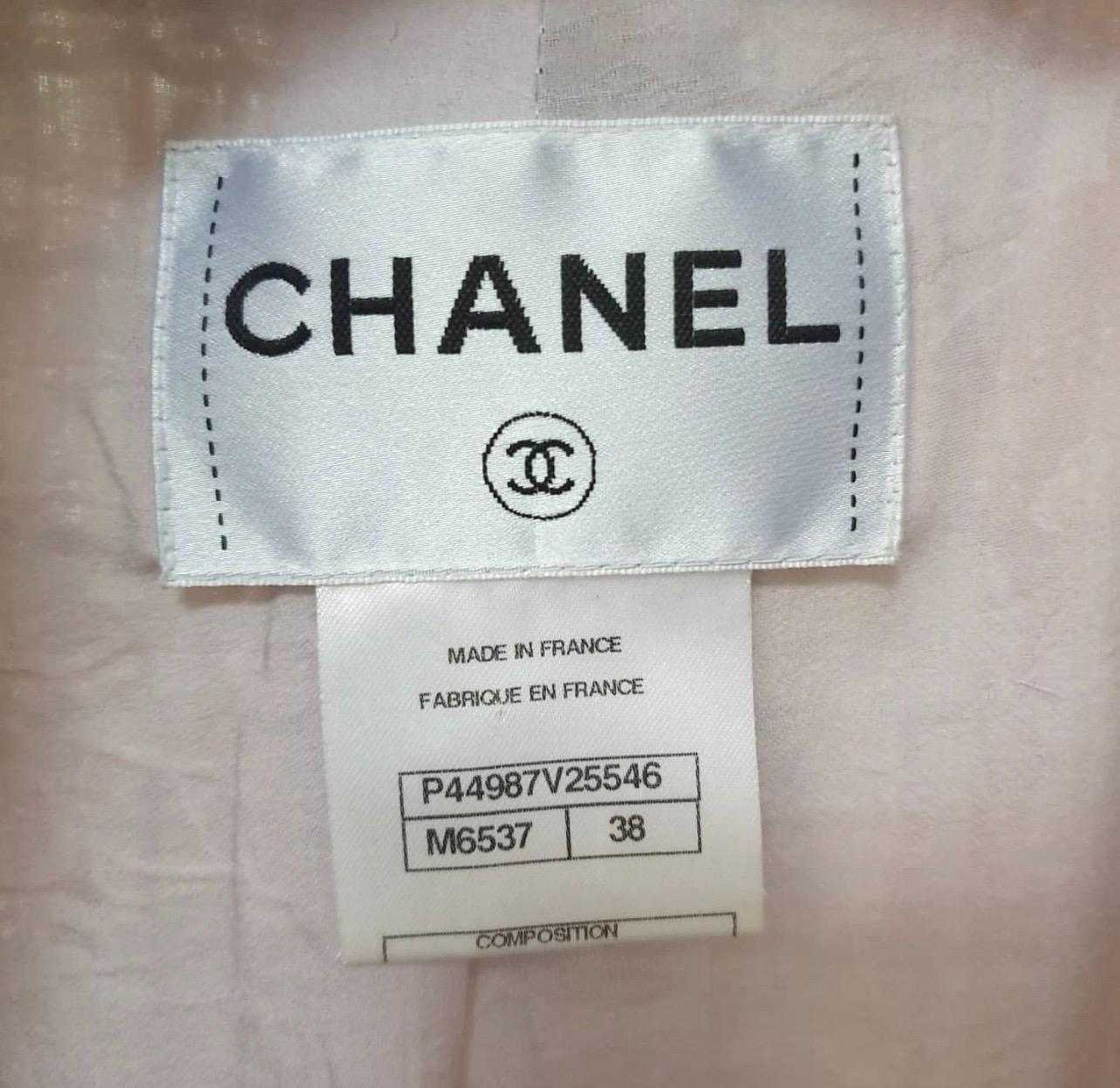 CHANEL RUNWAY 13C VERSAILLES COLLECTION 
GORGEOUS FANTASY TWEED JACKET

Design:
- Iconic Chanel fantasy tweed jacket crafted with ricrac trim from the Runway 13C Versailles Collection.
- Notch lapels.
- Pastel colors.
- Dual flap pockets at hip.
-