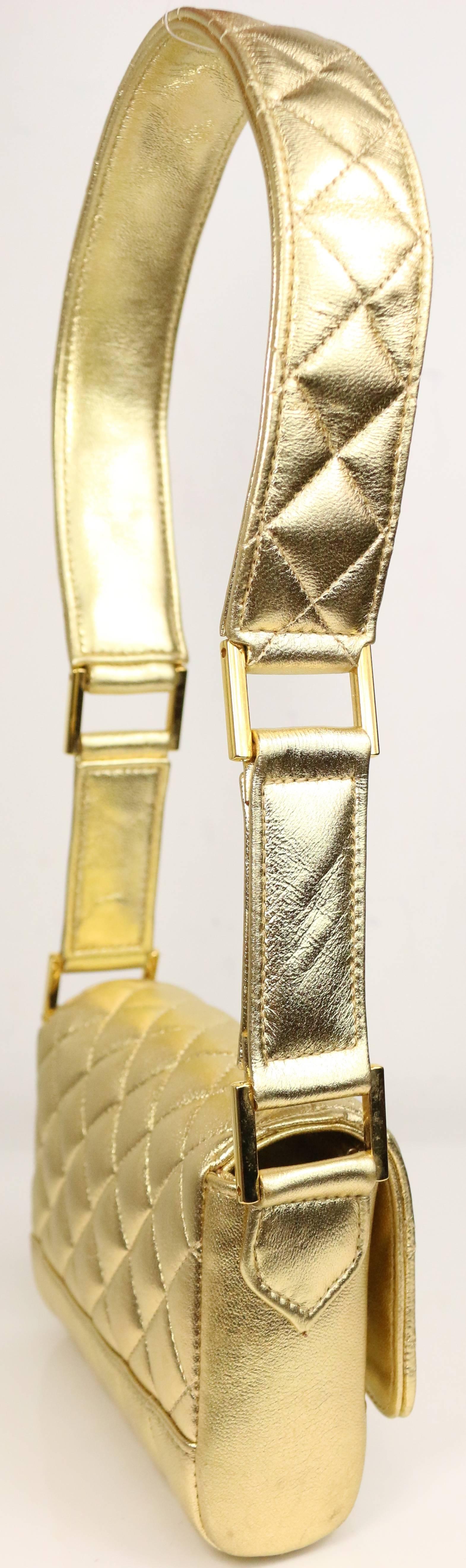 - Chanel 13cm gold metallic lambskin leather quilted flap shoulder bag.

- Featuring two gold hardwares on each side of the shoulder strap and one interior pocket.

- Length: 5.25 inches. Height: 4inches. Width: 1.57 inches. Handle Drop: 9inches.

-