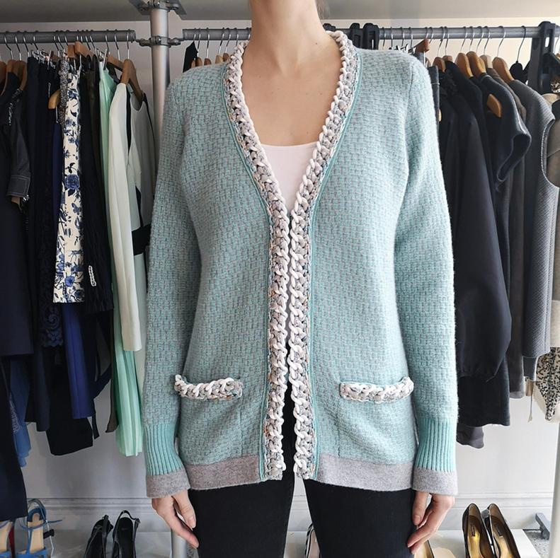 Chanel 14C Light Aqua Green Cashmere Cardigan with White Chain Trim.  Fantasy tweed trim,  white plastic curb chain detail, concealed snaps at front pockets, fastens with hidden hook and eye closures.  Marked size FR 38 (USA 6) with a relaxed fit. 