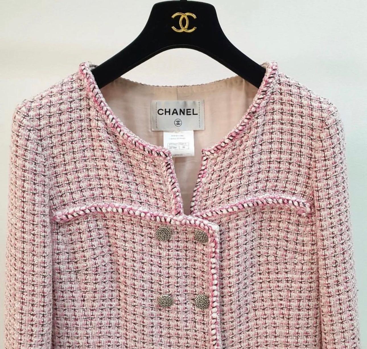 Chanel 14C Paris-Singapore Pink Tweed Jacket 
Sz.38 FR.  
Features braided trim, dual patch pockets, silver-toned CC buttons, camellia silk lining, and chain-weighted hem for perfect drape.
Very good condition. Slight dirtyness on the lining in