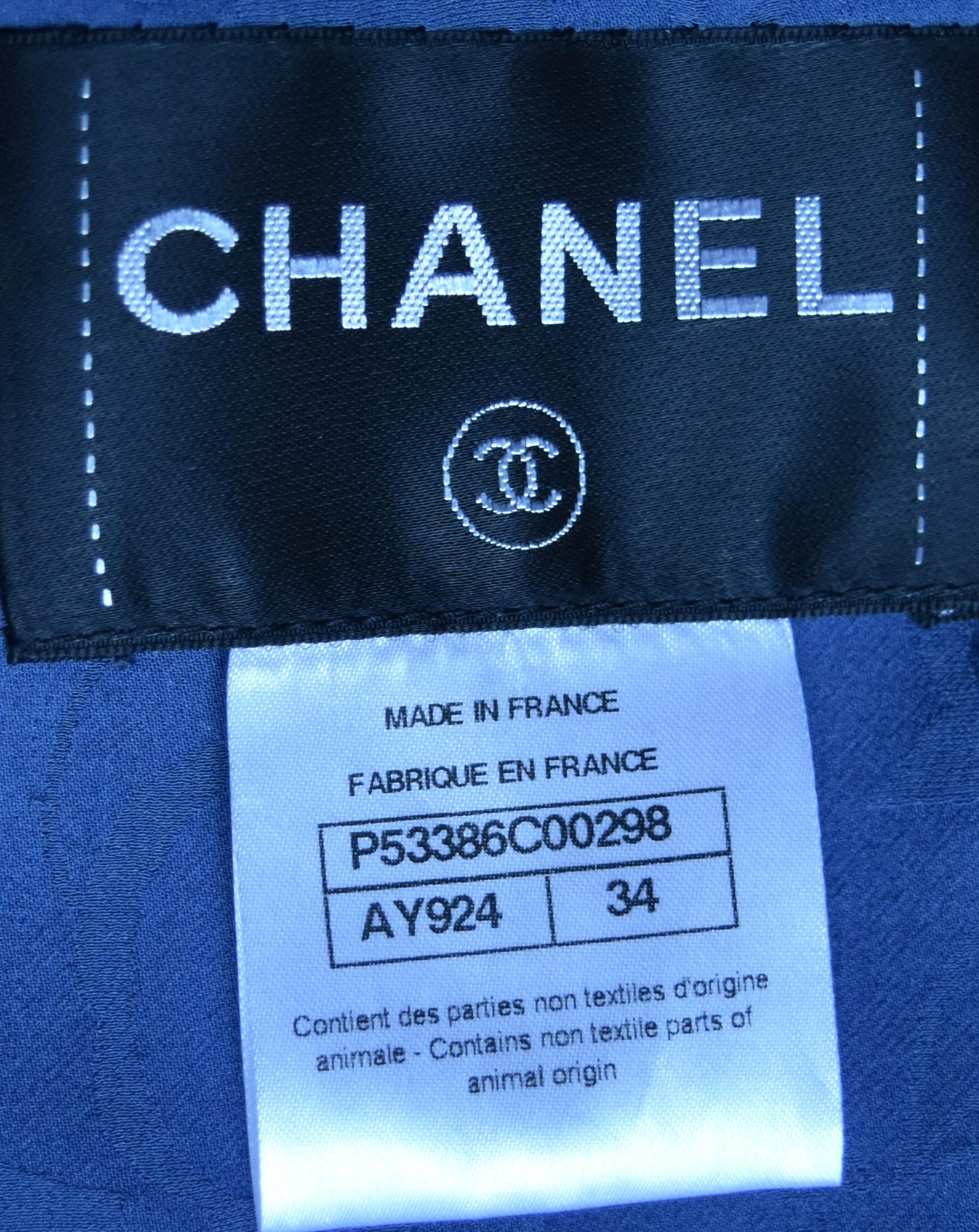Chanel 2016 tweed embellished jacket fashioned with full length zip front closure. It is new without tag.