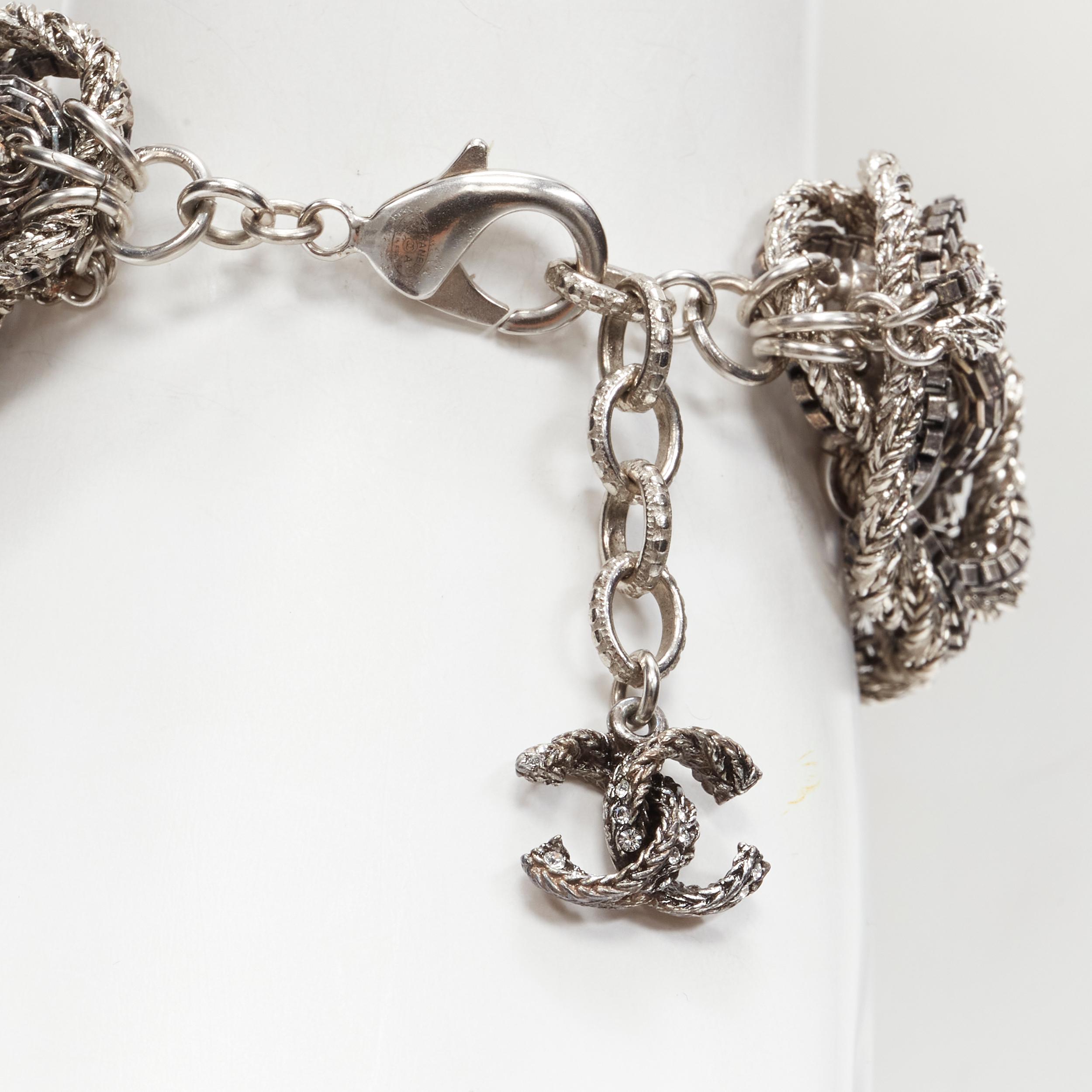 CHANEL 17A Paris Cosmopolite silver CC crystal charm twist chain bracelet
Brand: Chanel
Designer: Karl Lagerfeld
Collection: 17A Paris Cosmopolite Metier D'Art 
Material: Metal
Color: Silver
Pattern: Solid
Closure: Lobster Clasp
Extra Detail: