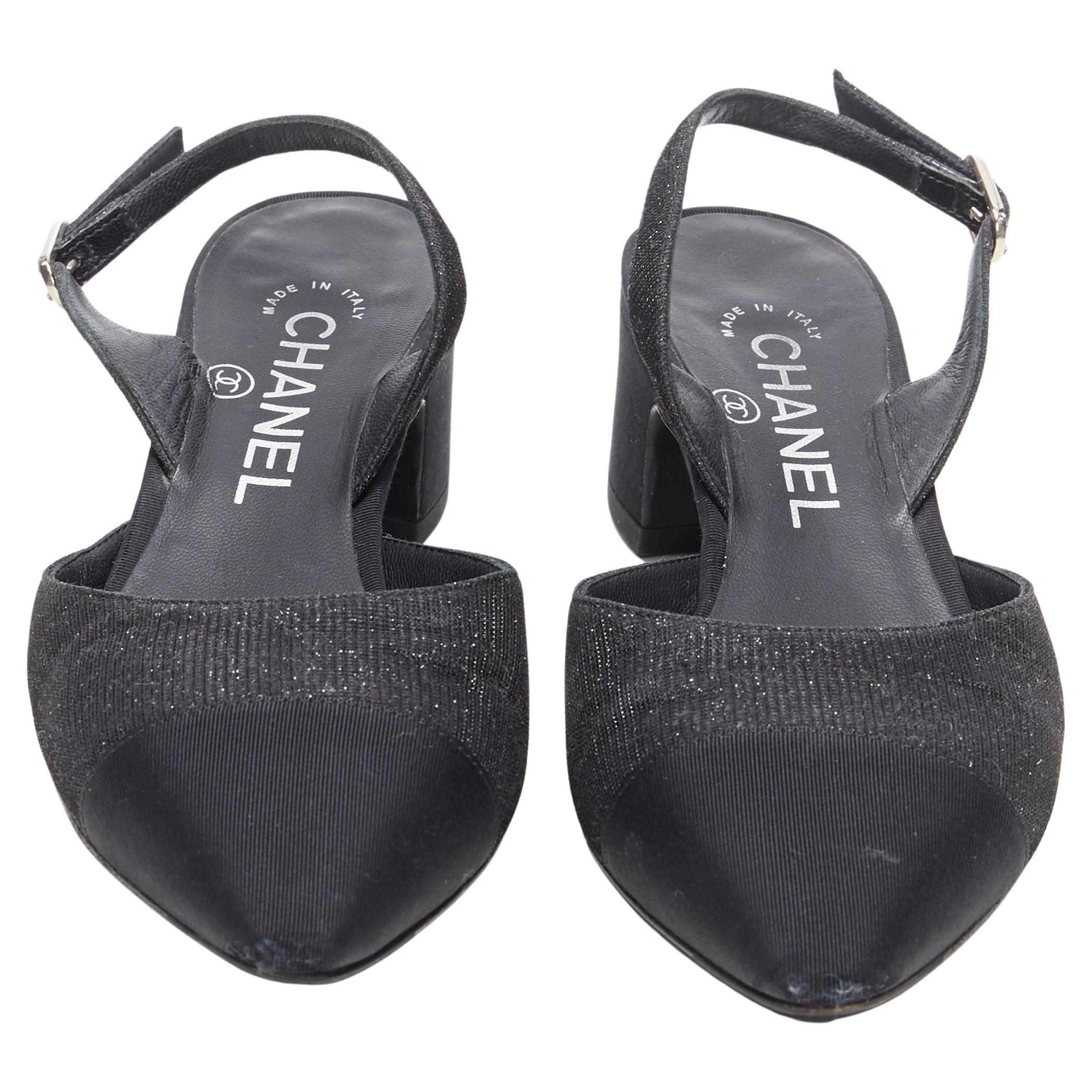 CHANEL 17B black glittery grosgrain toe cap logo chunky heel slingback pump EU36 
Reference: TGAS/A05238 
Brand: Chanel 
Designer: Karl Lagerfeld 
Model: Slingback pump 
Material: Fabric 
Color: Black 
Pattern: Solid 
Closure: Sling back 
Made in: