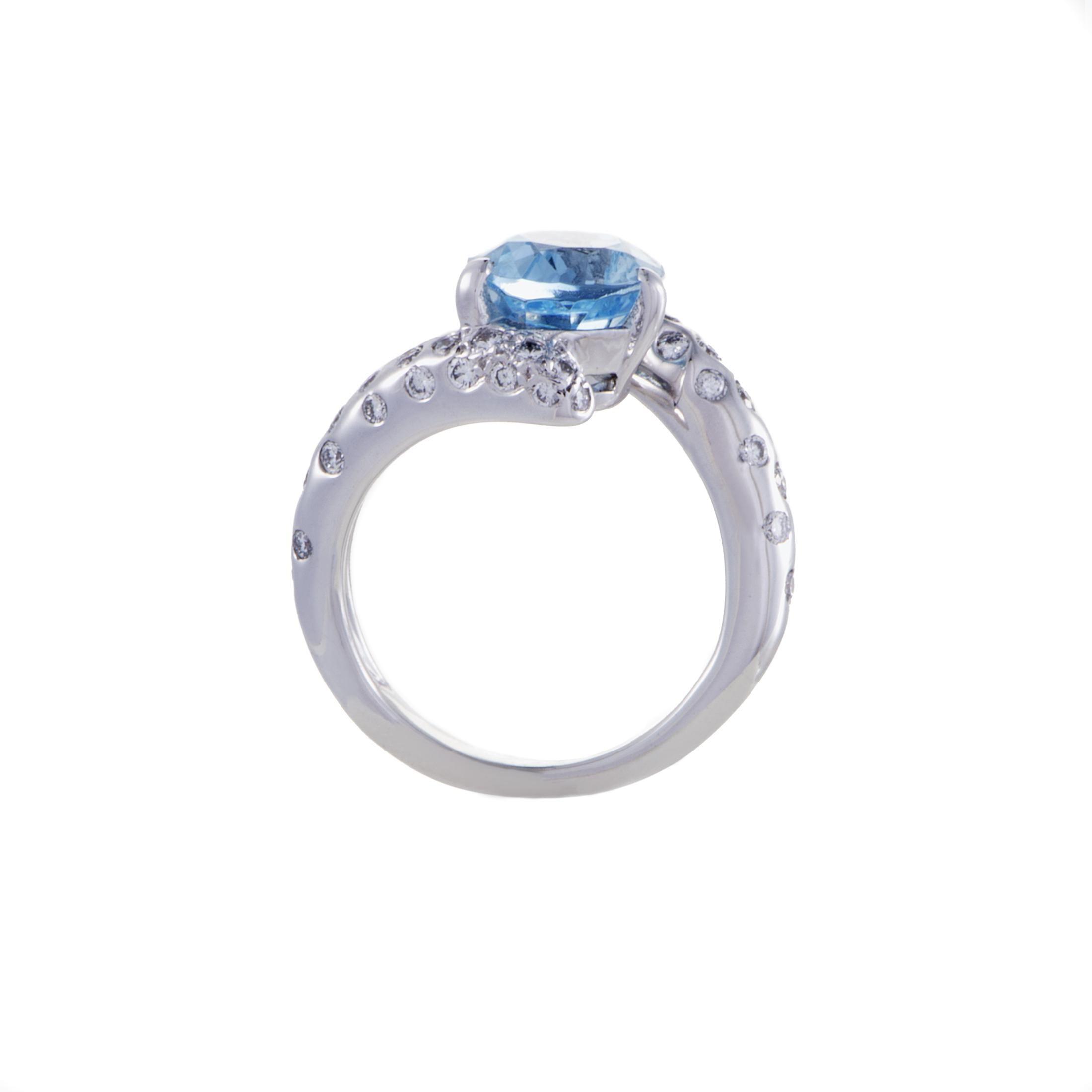 Lustrous diamonds are scattered along the immaculately gleaming surface of splendid 18K white gold in this charming ring from Chanel topped off with an astonishing aquamarine that exudes a refreshing glisten and pleasant color. 
Ring Top Dimensions: