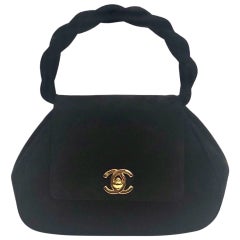 Vintage Chanel 18cm black suede "CC" turn-lock twisted handle bag