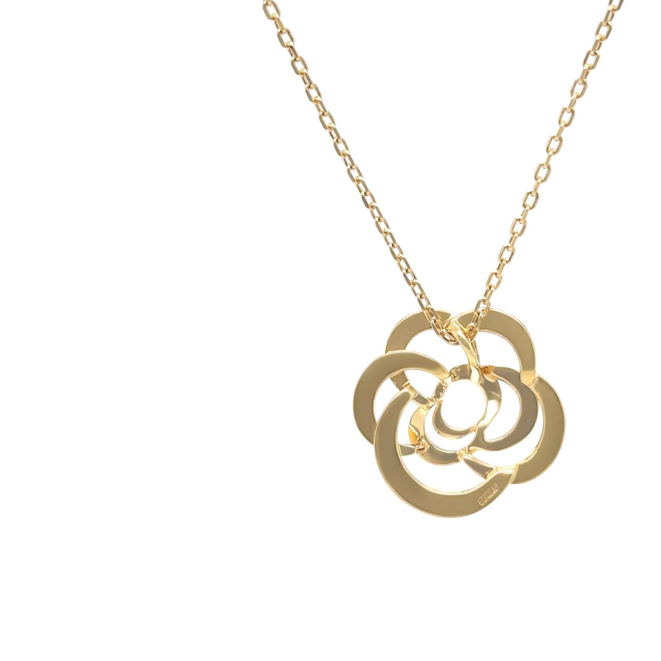 An elegant Chanel Fil De Camélia necklace crafted in 18ct yellow gold, featuring a delicate openwork camellia flower pendant measuring 19.4mm x 19.3mm. The fine chain measures 41cm in length with an adjustable clasp, and a maximum width of 1.3mm,