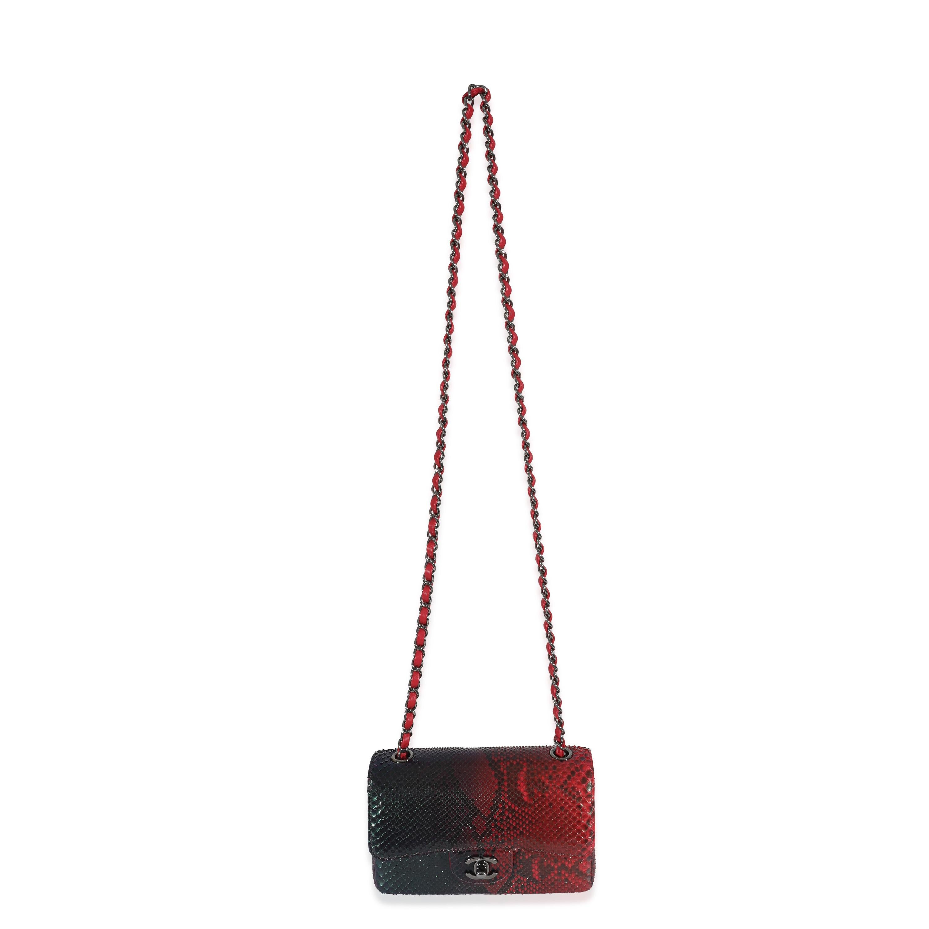 Listing Title: Chanel 18K Red Black Ombre Iridescent Python Mini Flap Bag RHW
SKU: 130775
MSRP: 6100.00
Condition: Pre-owned 
Condition Description: A timeless classic that never goes out of style, the flap bag from Chanel dates back to 1955 and has