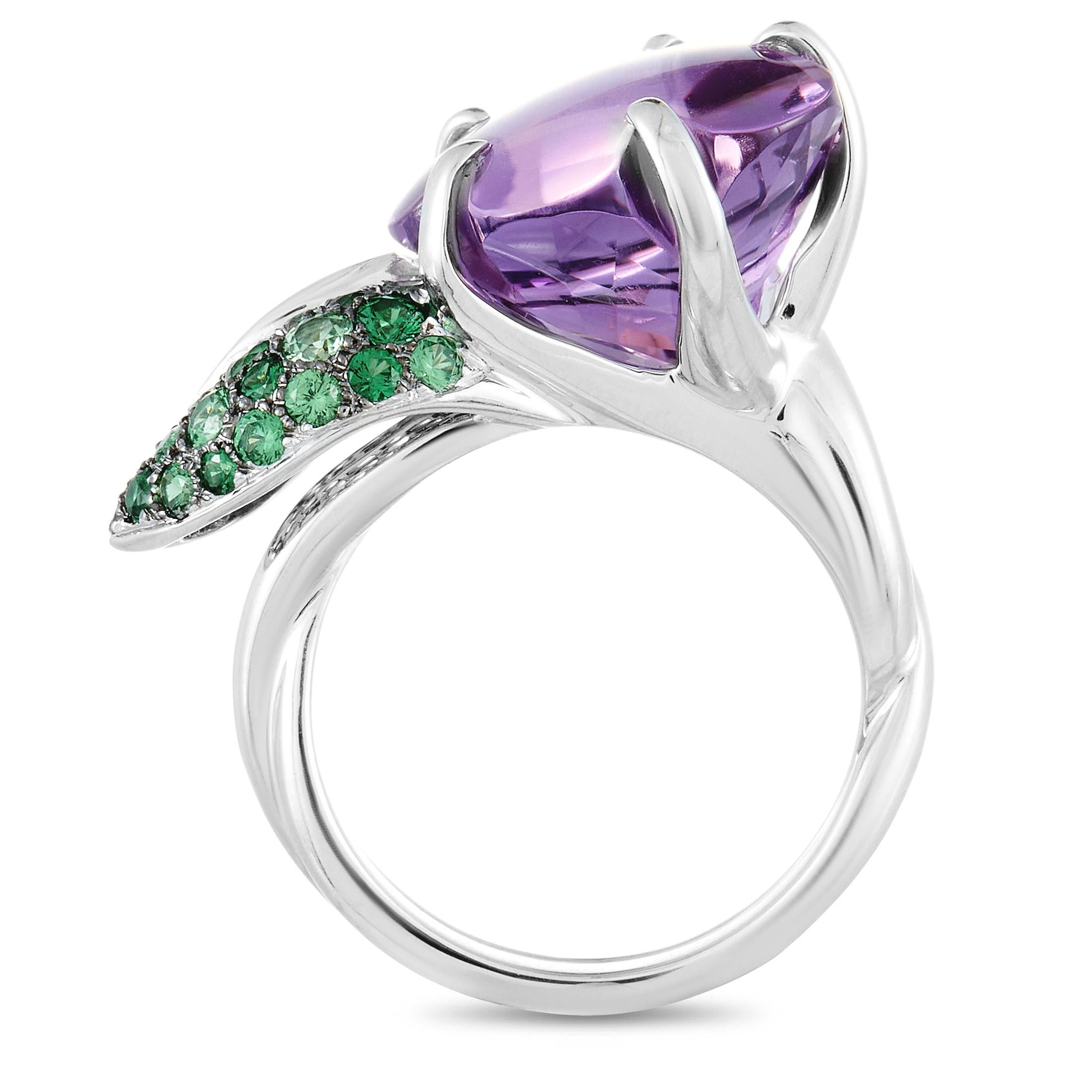This Chanel flower ring is made of 18K white gold and embellished with tsavorites and an amethyst. The ring weighs 14.2 grams. It boasts band thickness of 5 mm and top height of 10 mm, while top dimensions measure 21 by 15 mm.
 
 The ring is