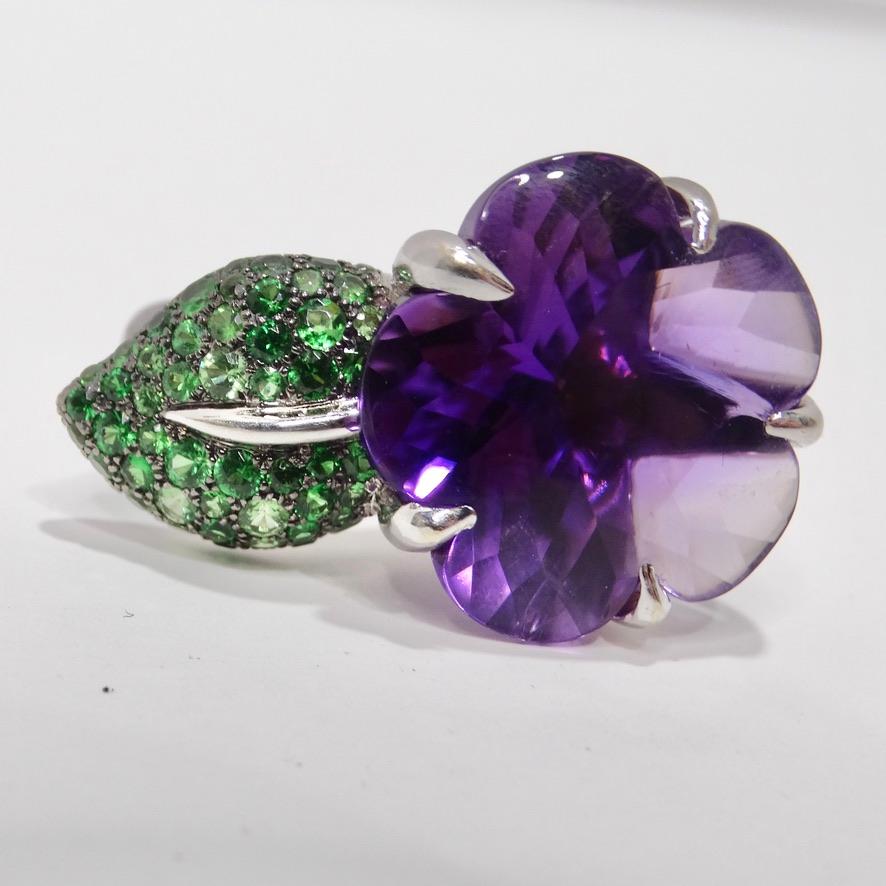 How incredible is this Chanel amethyst and tsavorite flower ring?! The perfect statement ring begging to be added to your collection, this Chanel ring is compromised of 18K white gold and embellished with green tsavorites to create the leaf. A