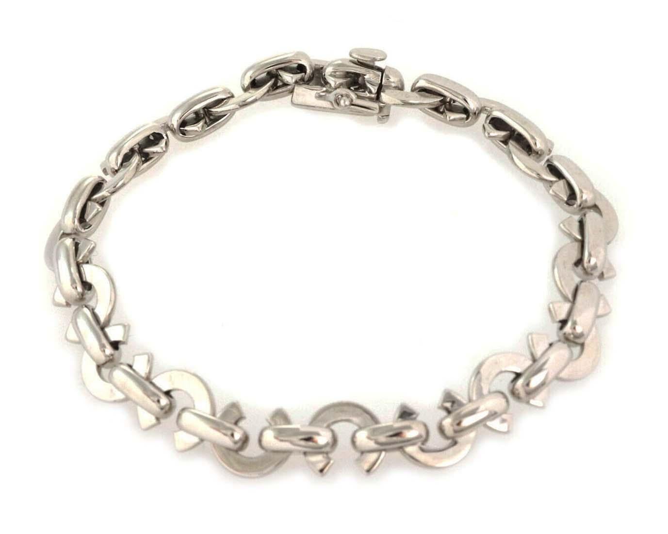 This authentic bracelet is by designer Chanel, it is crafted from 18k white gold with a polished finish featuring C links, each joined together by an oval link. The bracelet secures with a push in clasp and has full designer signature with the gold