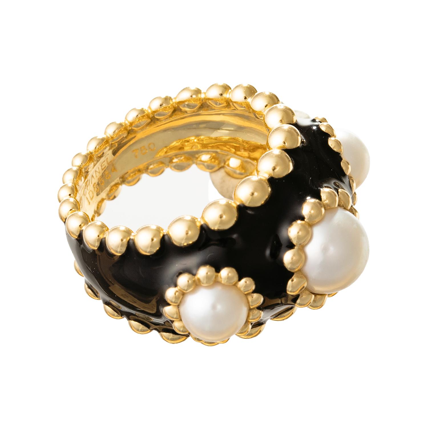 Chanel wide band ring in 18k yellow gold, the front applied with black enamel and accented by three bezel-set cultured pearls, with perlee beaded edges.  Pearls measuring 6 to 8mm in diameter. Signed 