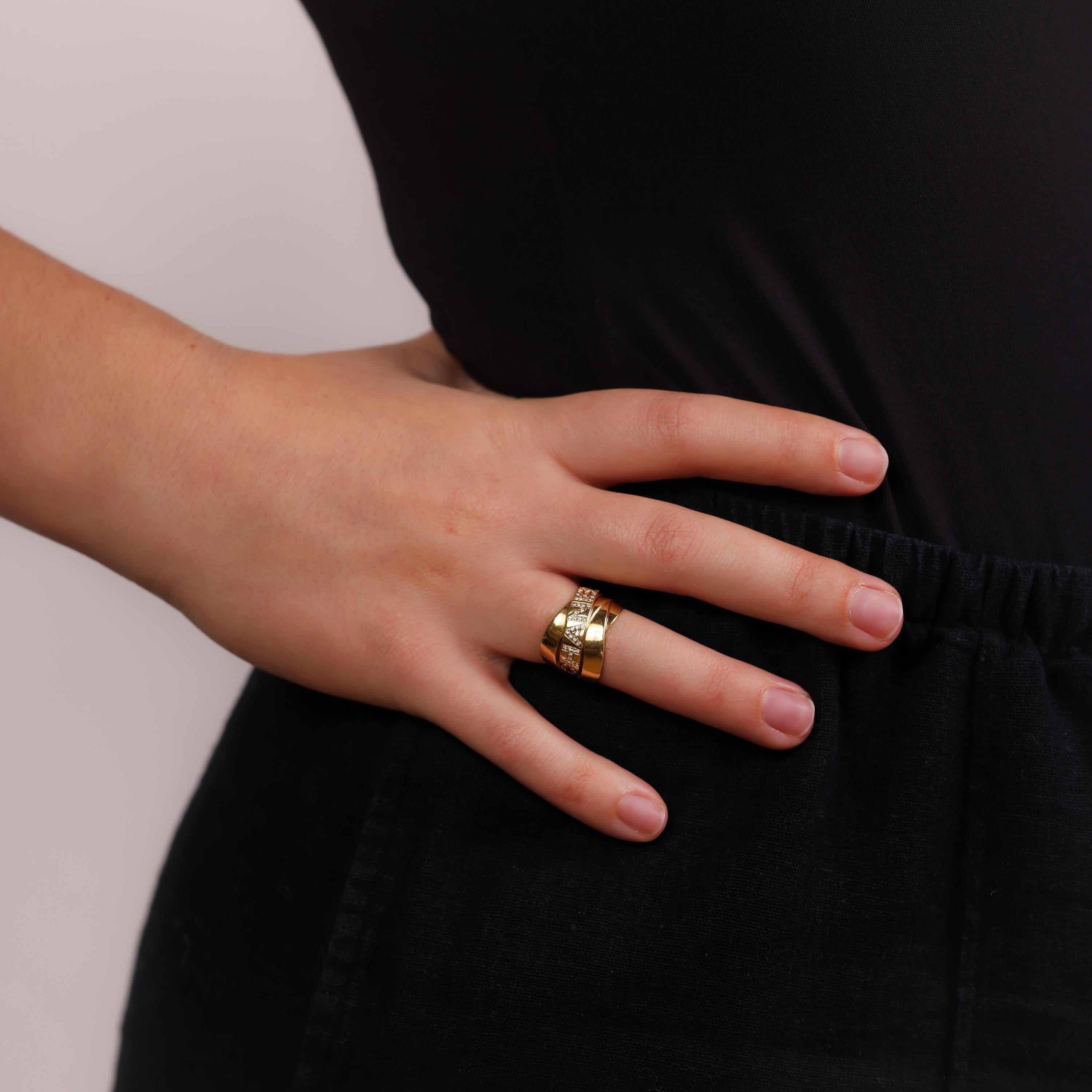 This vintage Chanel 18k yellow gold ring sparkles with 51 brilliant diamonds, embodying timeless elegance and luxurious craftsmanship from the 2000s.

Brand: Chanel
Stones: 51 round brilliant diamonds
Total weight: Approximately 0.26 carats
Color: