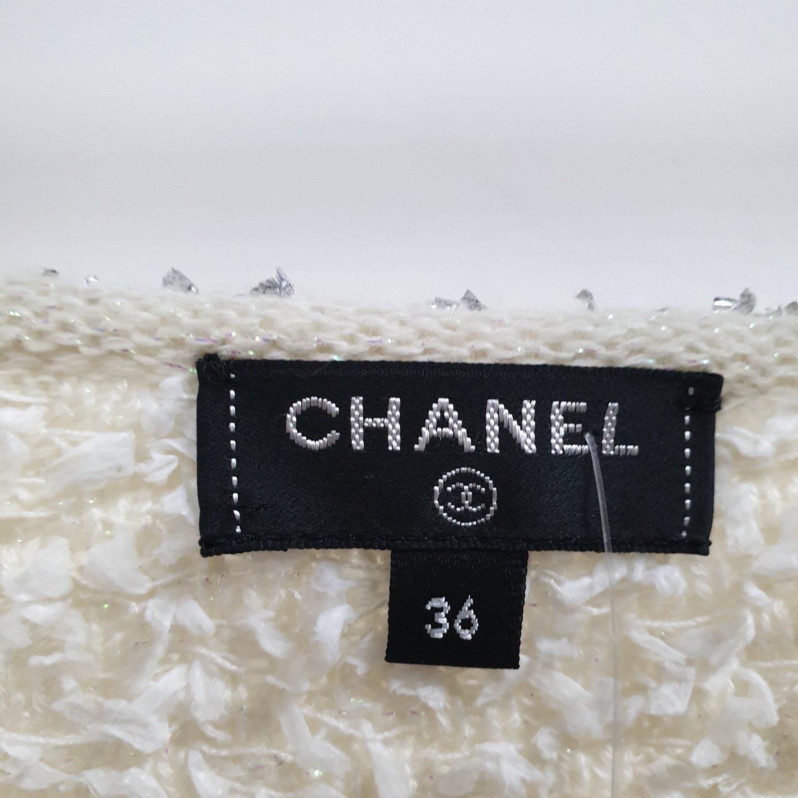Chanel Asymmetrical Knit Tank top, a runway piece from 2018 Spring-Summer 'Waterfall' collection. An absolutely gorgeous boucle tweed knit in shades of ecru, pink, aqua and silver. As featured on the front cover of the book 