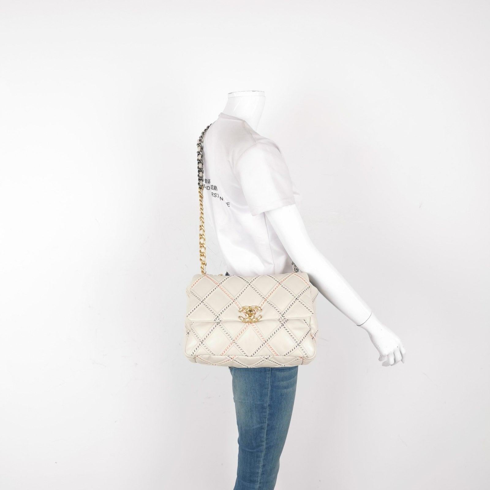 Chanel 19 Bag 2021 Cream White Wild Stitch These are professional photos of the actual bag offered by Luxbags. The Chanel 19 bag was the last bag to be designed by Karl Lagerfeld. Own a piece of history through this bag. Its relaxed leather and