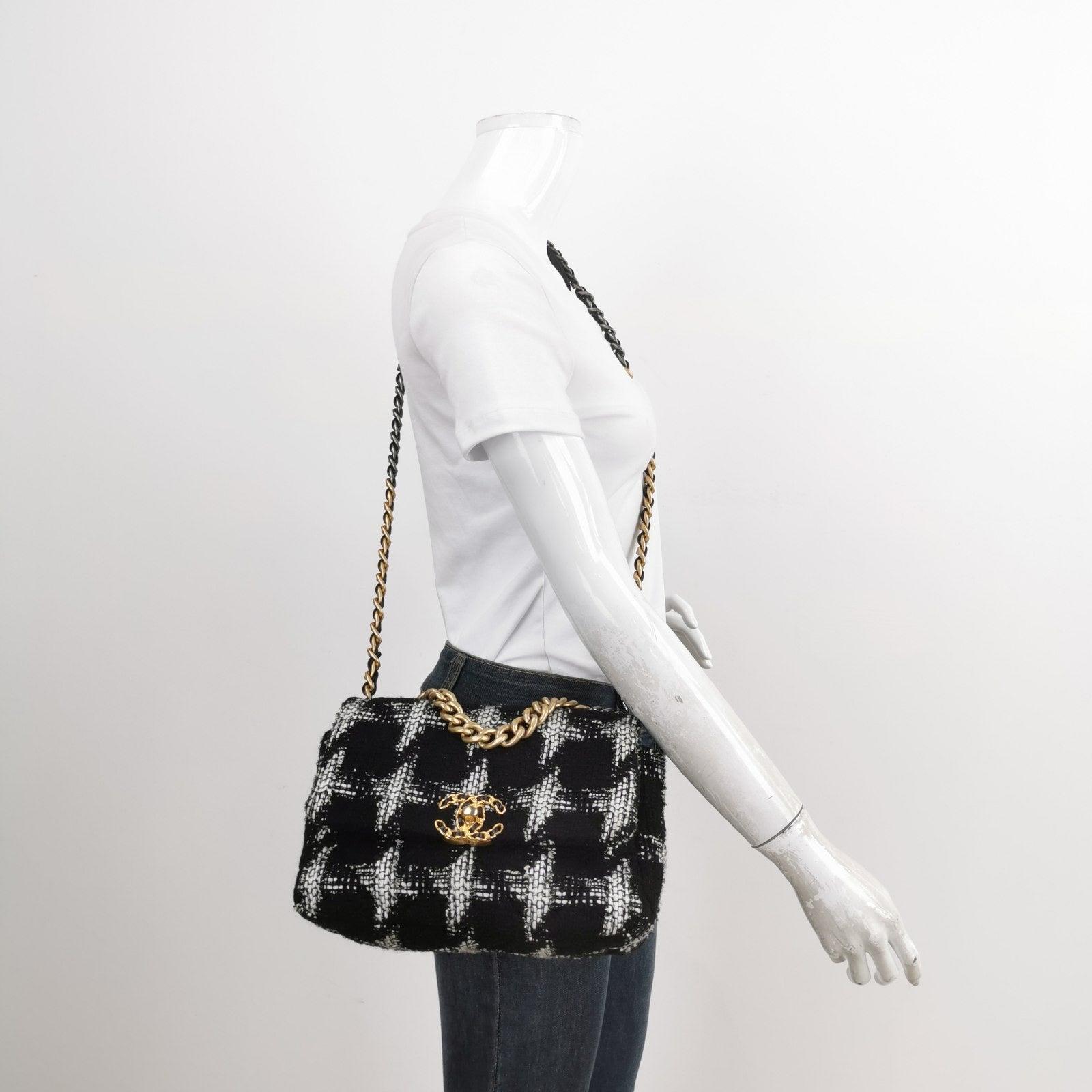 Chanel 19 Bag 2021 Small Black White Checkered Tweed Bag
  These are professional photos of the actual bag.
  This 2021 Chanel 19 Small Black White Checkered Tweed Bag has been expertly crafted in Italy, featuring an interwoven CC-lock that adds a