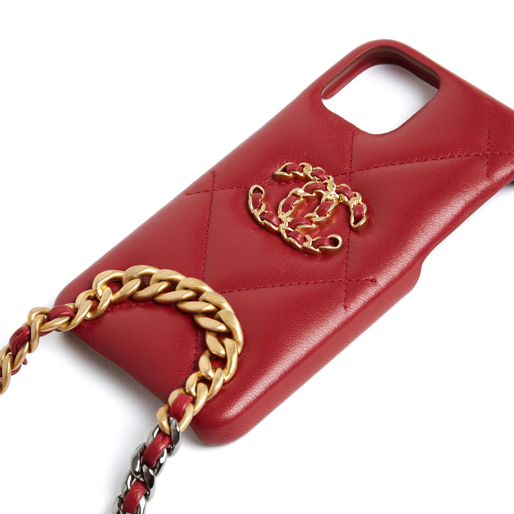 Chanel 19 series phone case - probably iPhone 11 Pro, S or XS in quilted red leather topped with a large CC in gold metal chain interwoven with leather, long shoulder strap in gold then silver metal chain, matte then shiny, leather tab to protect