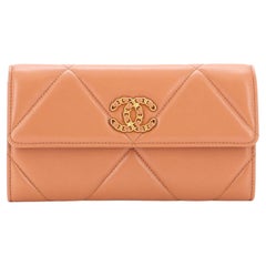 Chanel 19 long flap wallet - Shiny lambskin, gold-tone, silver-tone &  ruthenium-finish metal, coral pink — Fashion