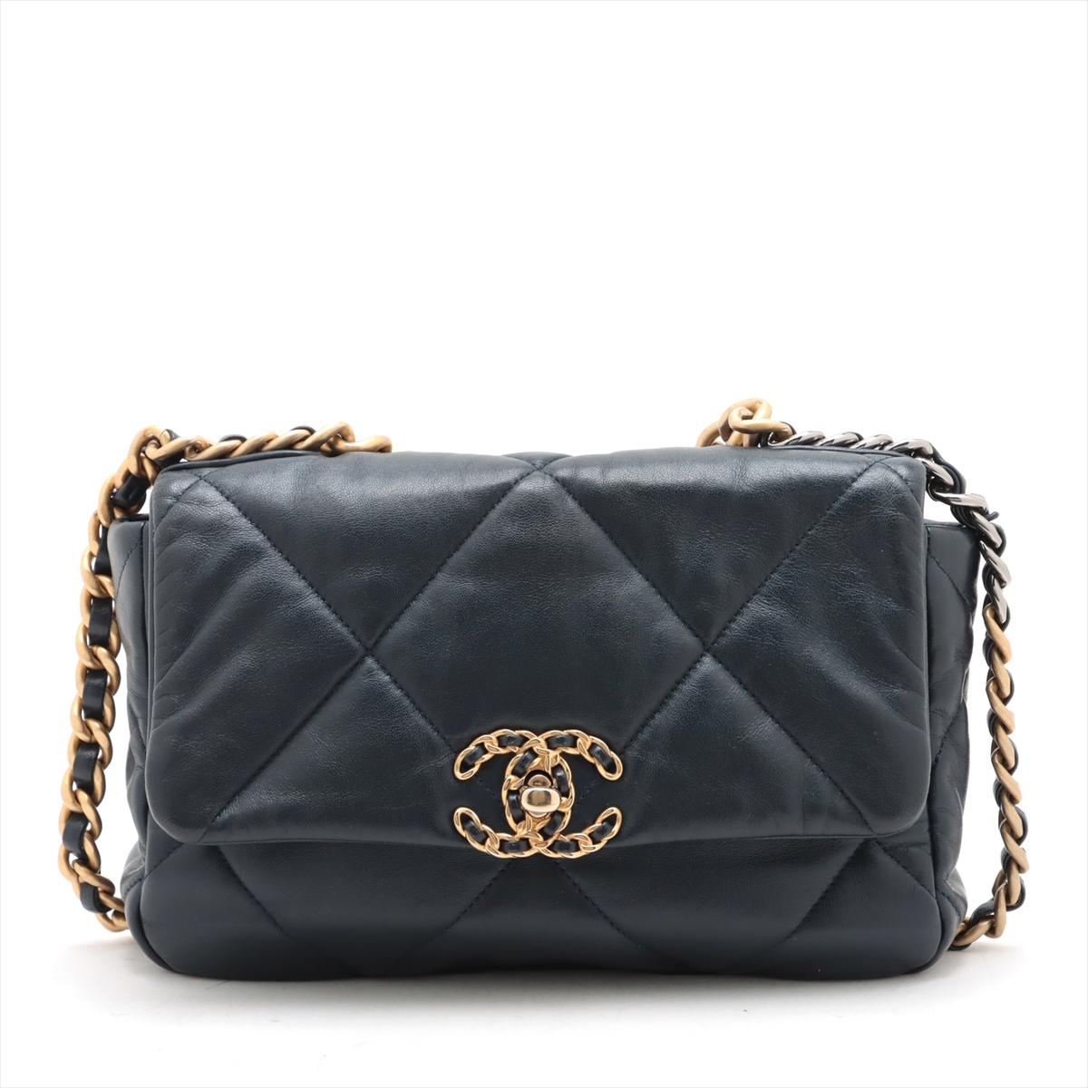 *will ship about 3/27*
The Chanel 19 Matelassé Lambskin Chain Shoulder Bag in Navy Blue is a bold yet timeless statement piece that blends modern elegance with classic Chanel heritage. Crafted from supple quilted lambskin leather, the bag features