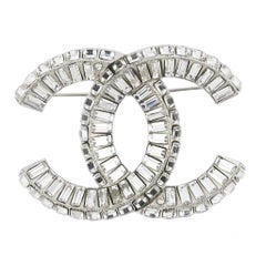 Chanel 1970s Silver-tone Interlocking CC Crystal Brooch, Baguette Cut