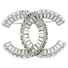 Chanel 1970s Silver-tone Interlocking CC Crystal Brooch, Baguette Cut