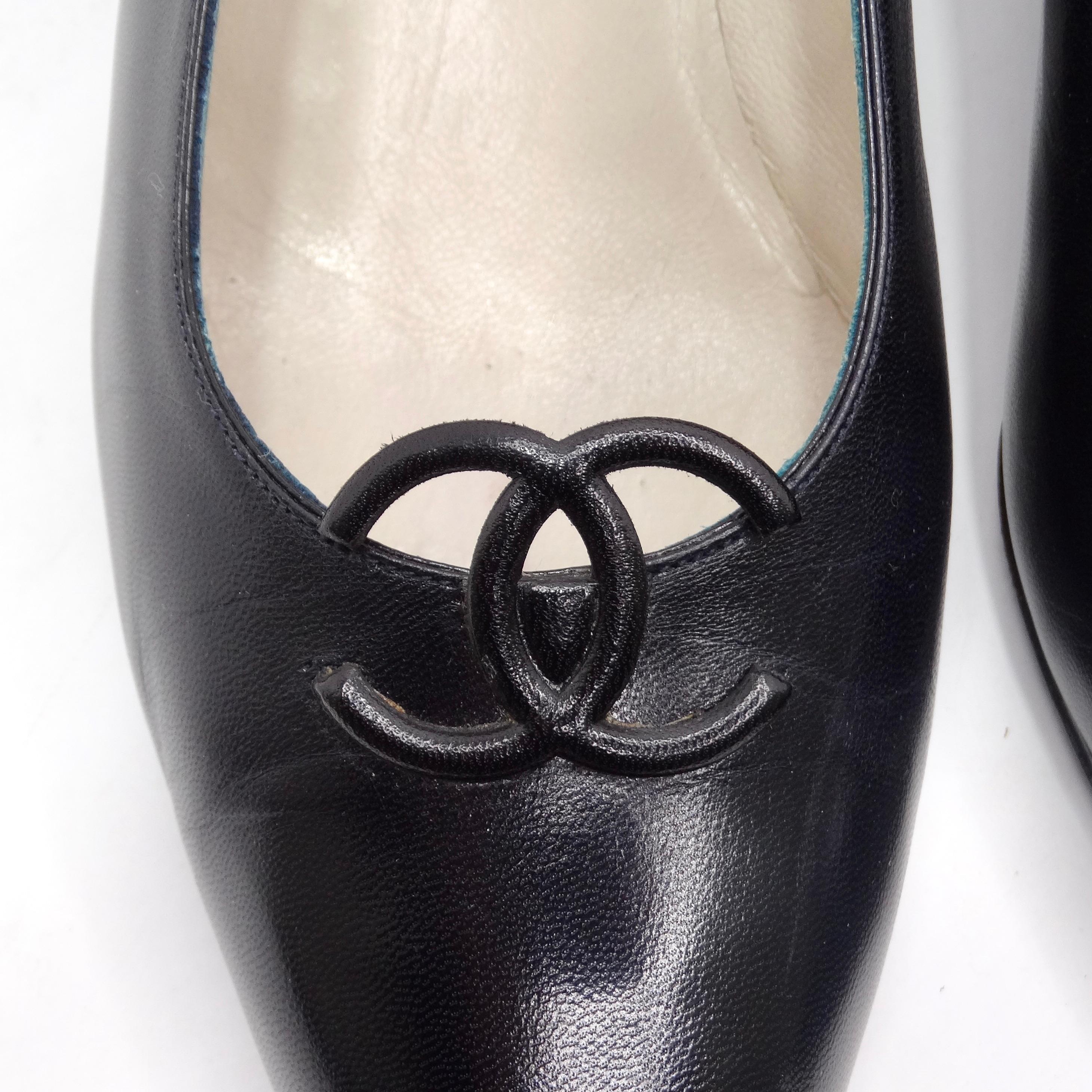 Introducing the Chanel 1980s CC Black Leather Kitten Heels – an embodiment of timeless elegance and understated luxury. These classic pointed kitten heels in smooth black leather are a versatile and chic addition to any wardrobe, perfect for daily