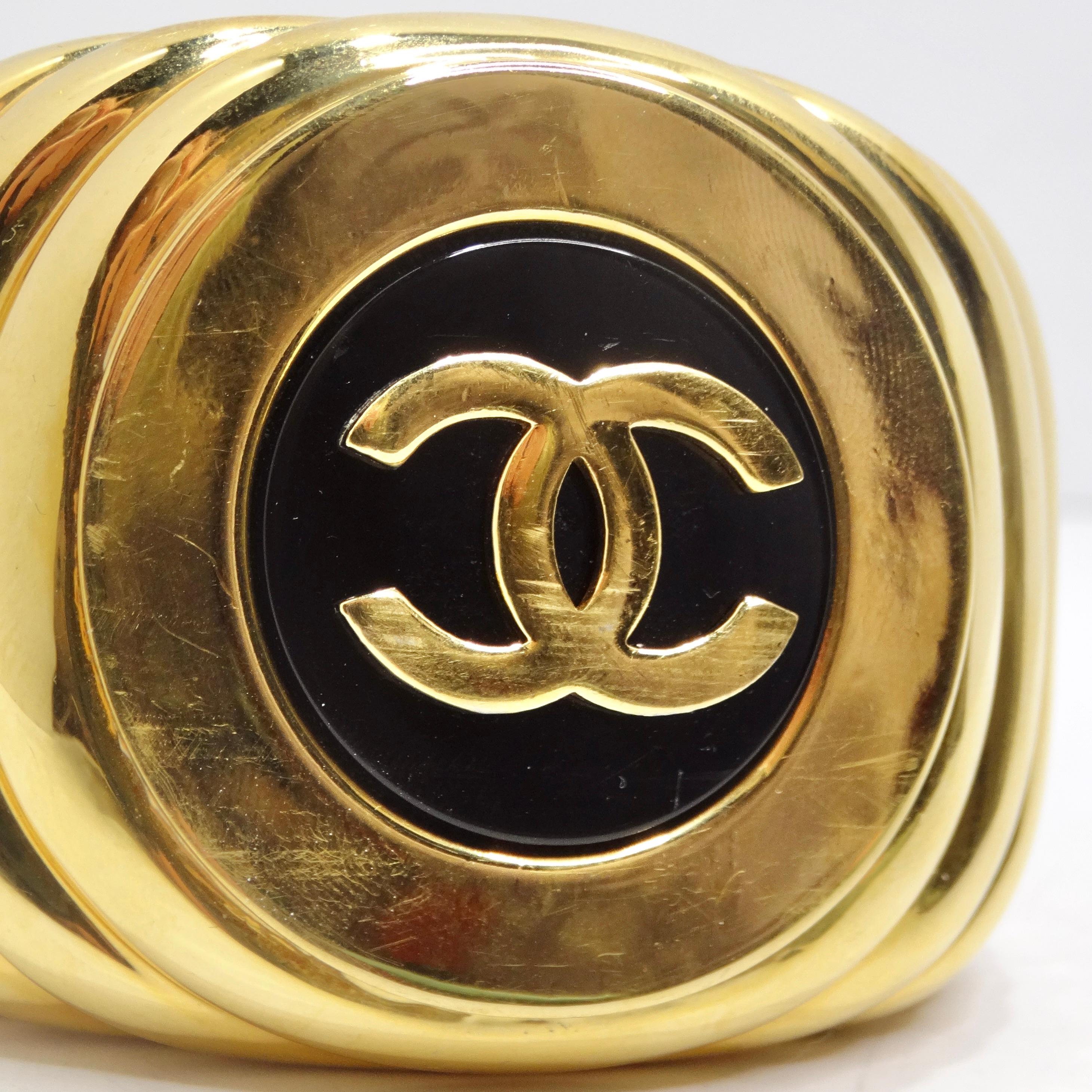 Chanel 1980s CC Logo Ribbed Gold Tone Cuff Bracelet In Excellent Condition For Sale In Scottsdale, AZ