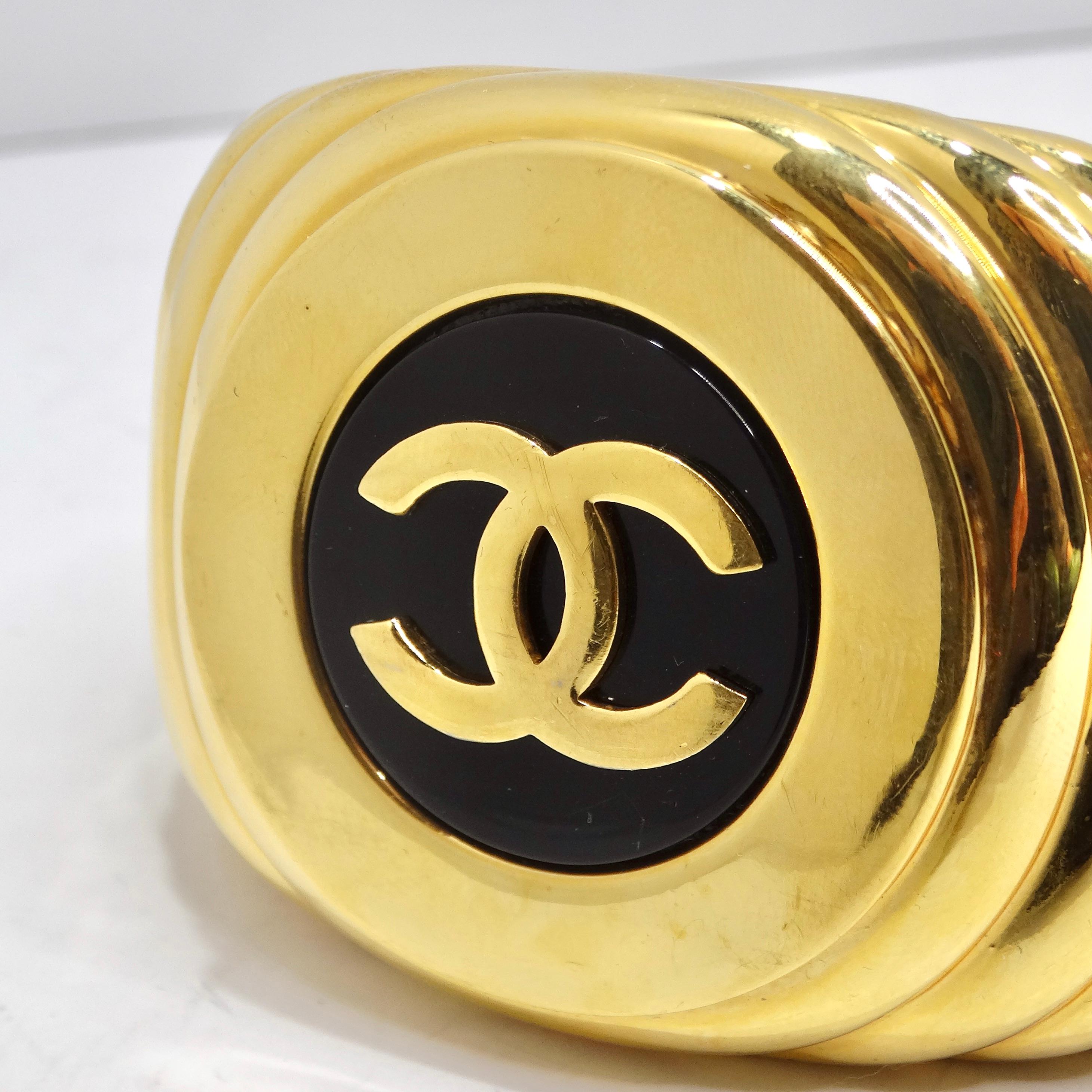 Women's or Men's Chanel 1980s CC Logo Ribbed Gold Tone Cuff Bracelet For Sale