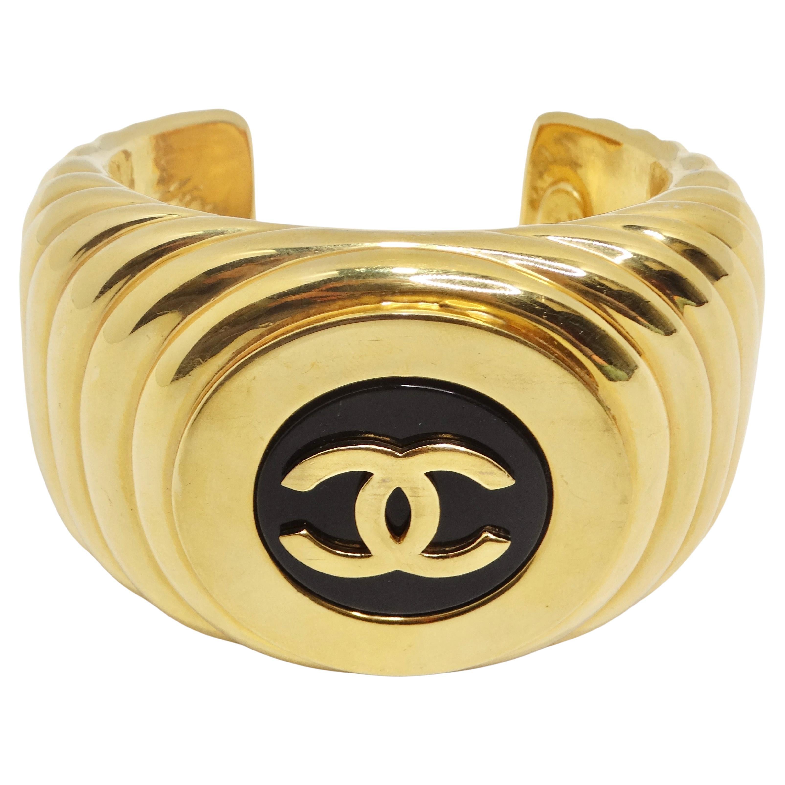 Chanel 1980s CC Logo Ribbed Gold Tone Cuff Bracelet For Sale