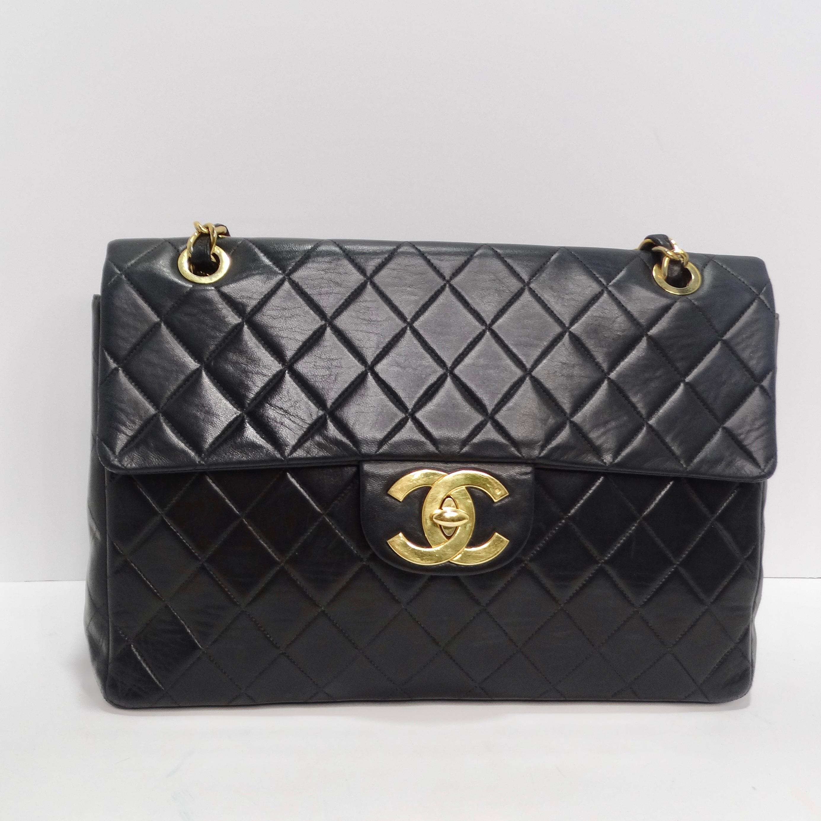 Introducing the Timeless Elegance of Chanel: 1980s Classic Black Leather Maxi Single Flap Handbag! Unveil the epitome of sophistication with our authentic CHANEL Lambskin Quilted Vintage Maxi Single Flap Handbag in Black. This stunning piece hails