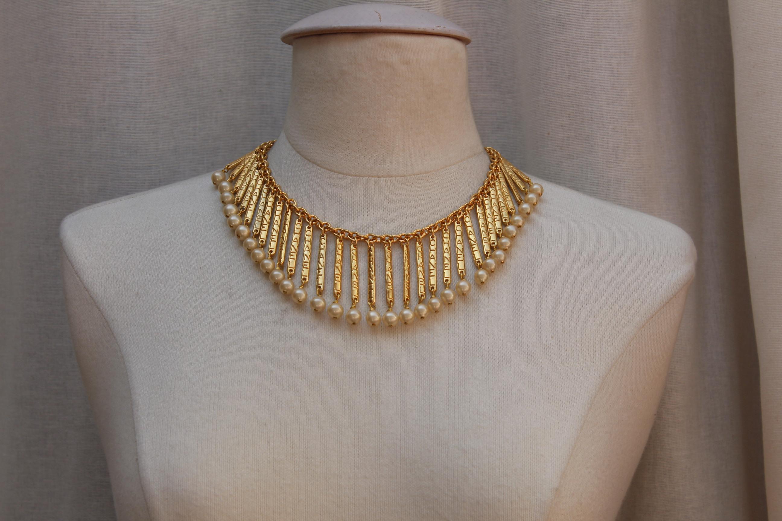 CHANEL 1980s Gilted metal breastplate necklace with hanging sticks In Excellent Condition In Paris, FR